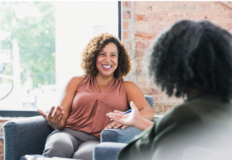 Two women talking happily