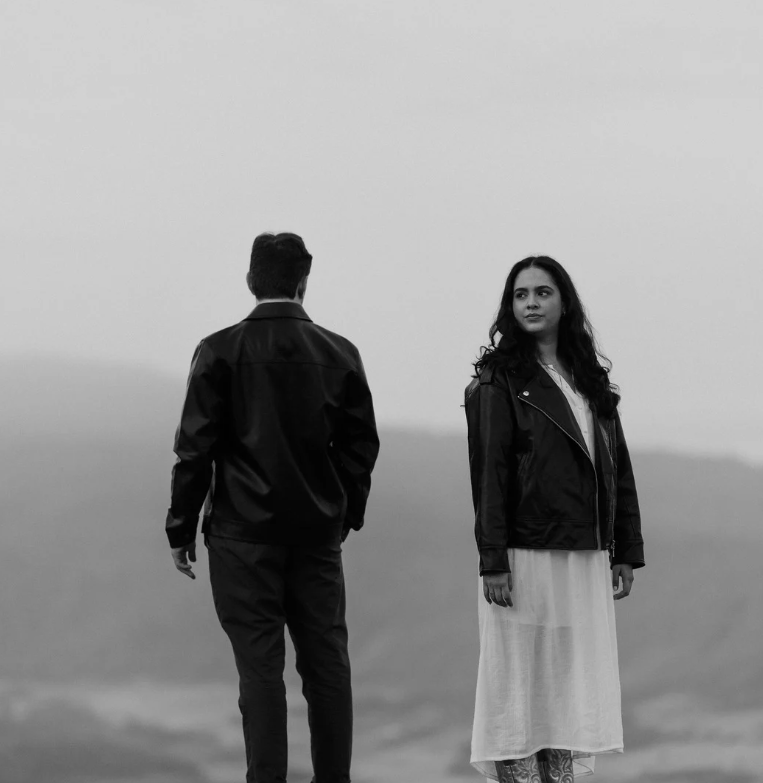 Couple facing opposite directions