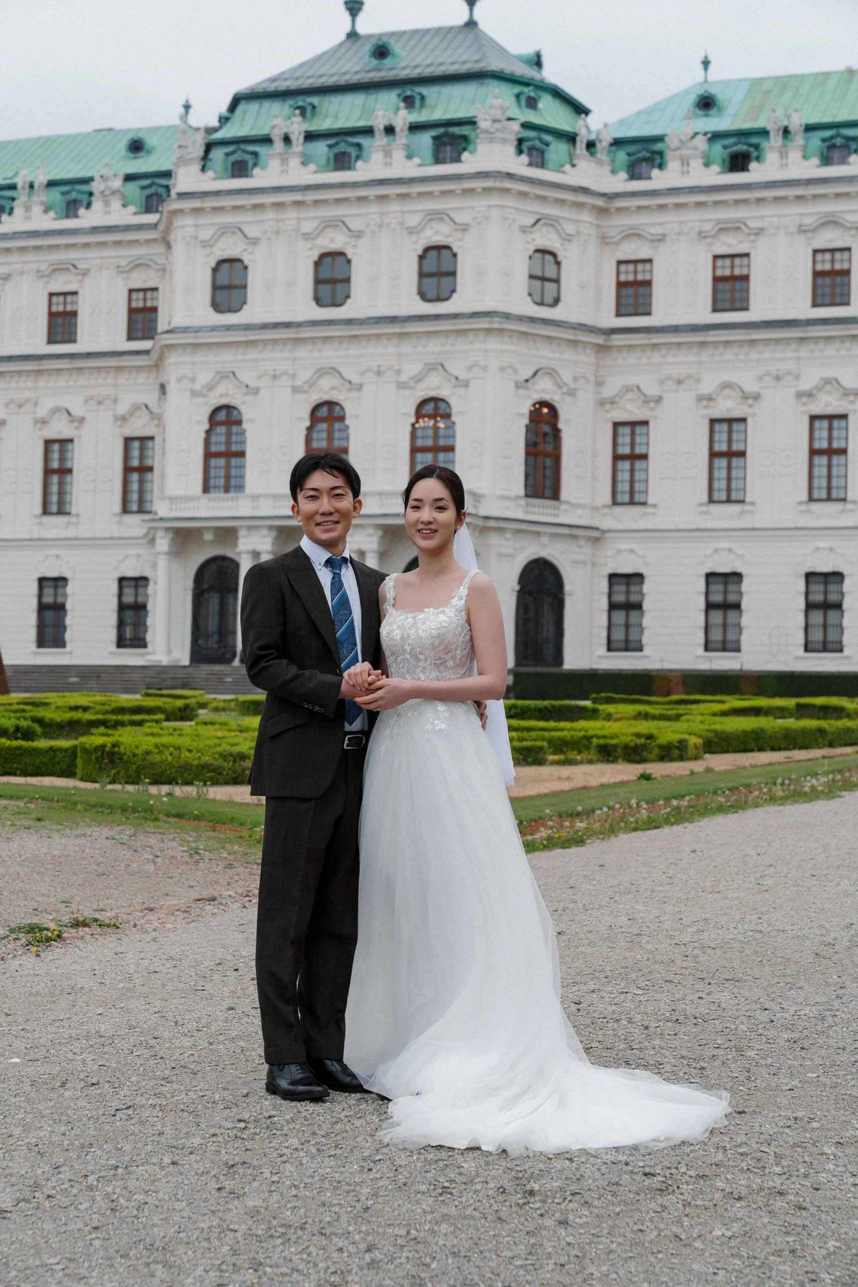 Korean Japanese couple Belvedere Palace outdoor Vienna wedding Fine Events Vienna