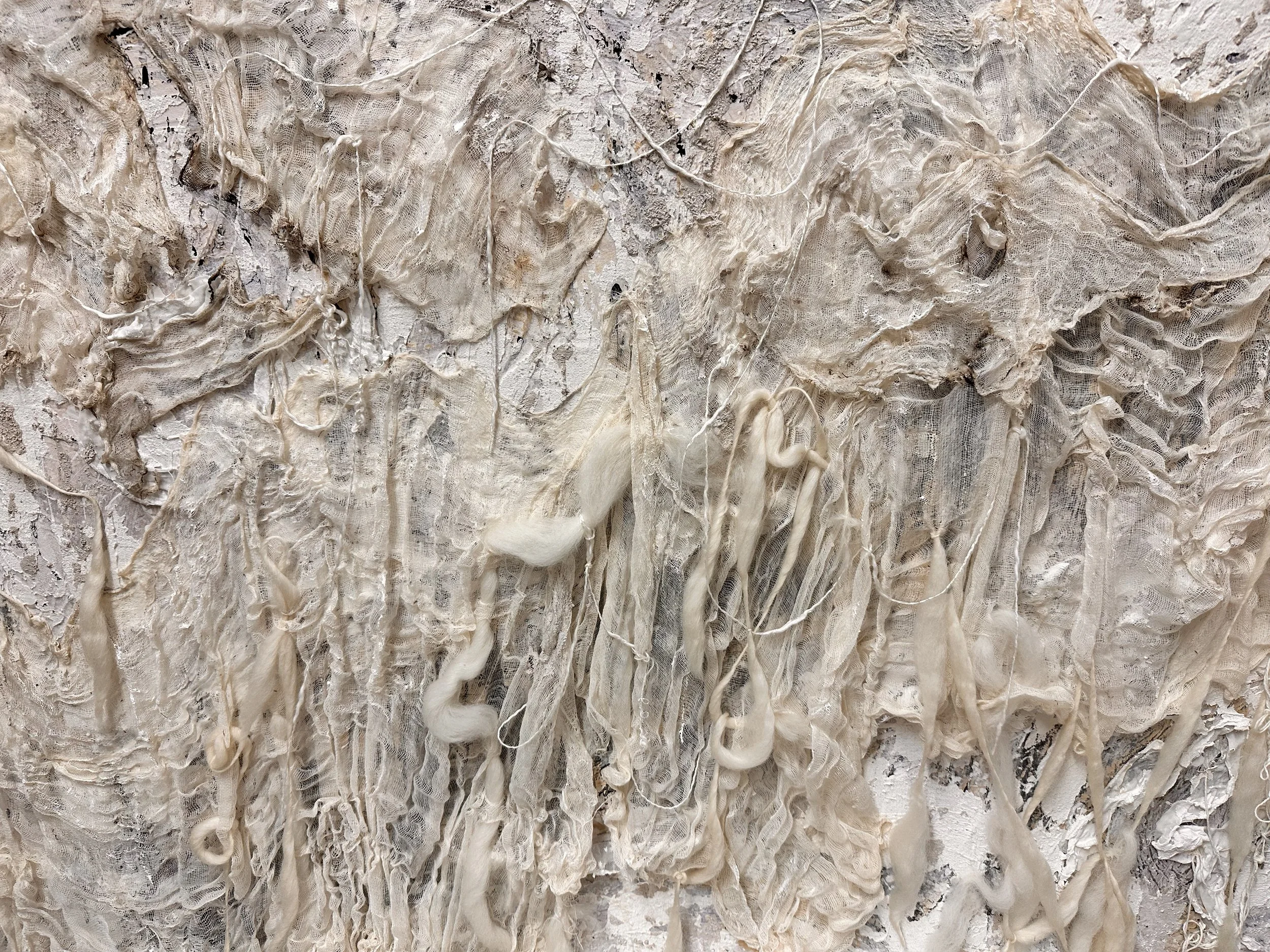 Close-up of fabric details of Rags to Riches - Cinderella Story by Deborah Phillips UK Artist - pulled threads, silk yarns, and sculpted textures showing a tactile and emotional transformation.