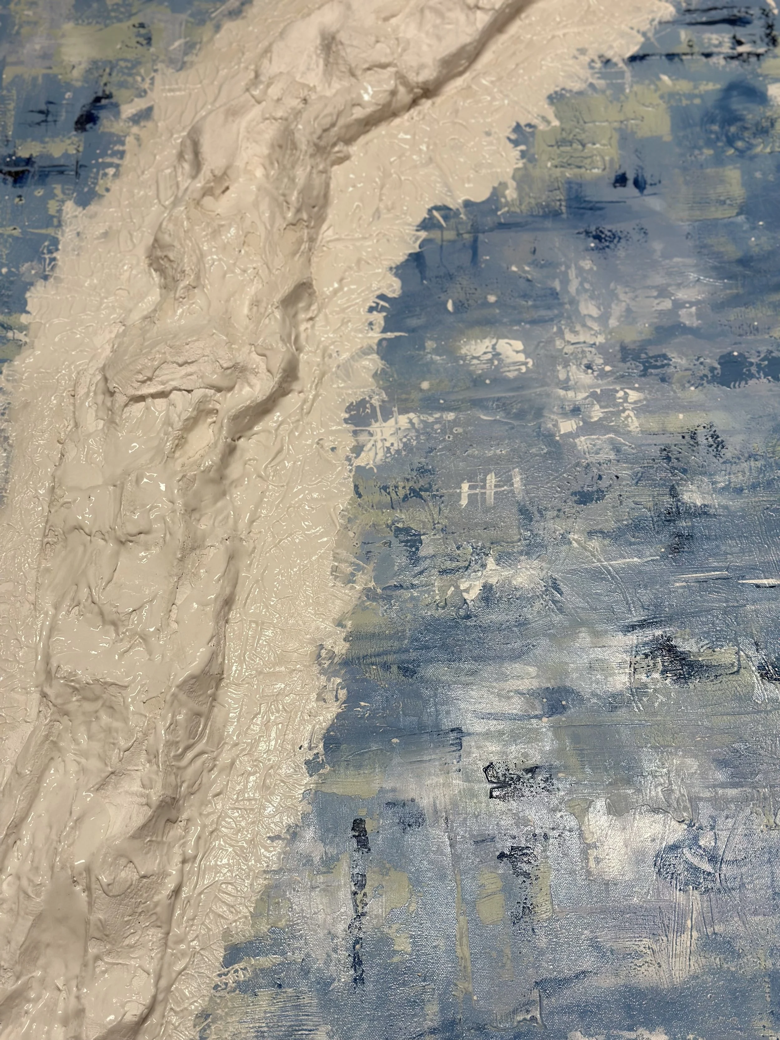 The snowy ledge covered in gluey, glossy, white paint, ready for the addition of the muslin fabric. blue background with green and white sweeping marks and dark blue paint visible
