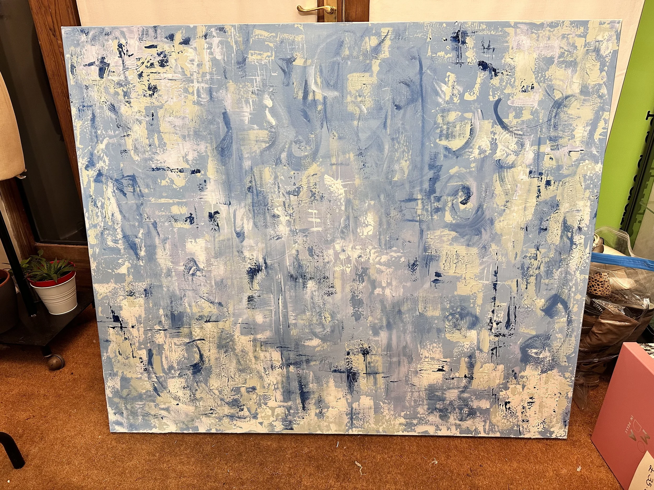 A full view of the canvas before the 3D fabric element was applied, showing abstract wintery textures and vibrant brushstrokes with lots of sweeping movements. A door handle can be seen behind, at the top of the canvas