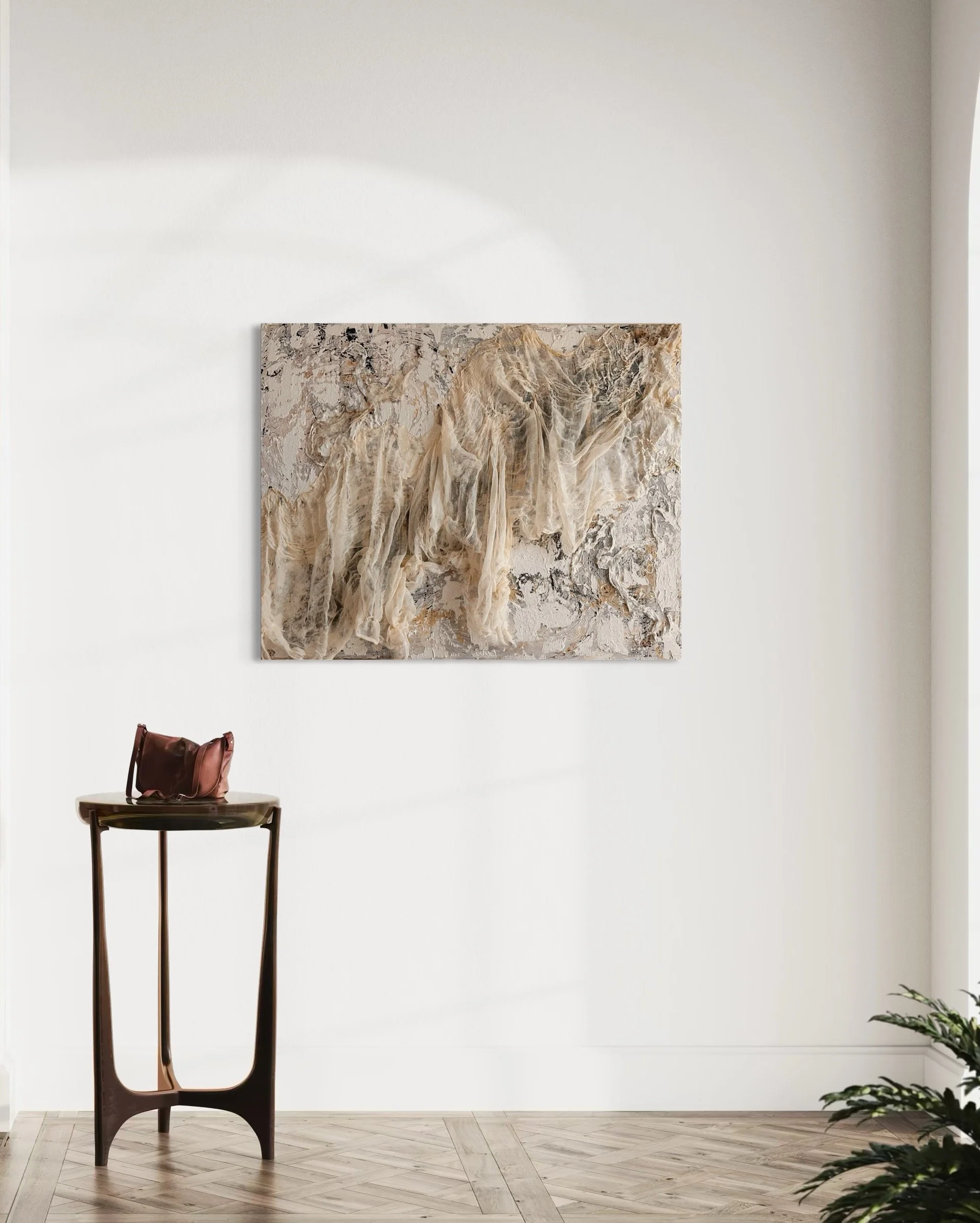 Rags to Riches - Cinderella Story, Textured and textile mixed media wall art by Deborah Phillips UK Artist. Image shows the natural toned artwork handing on a plain neutral coloured wall with a small wooden table with a bag on top