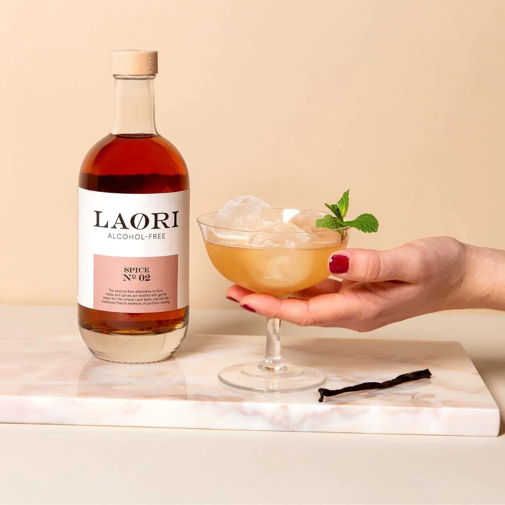A glass of non-alcoholic Dark and Stormy cocktail with laori Spice No. 2