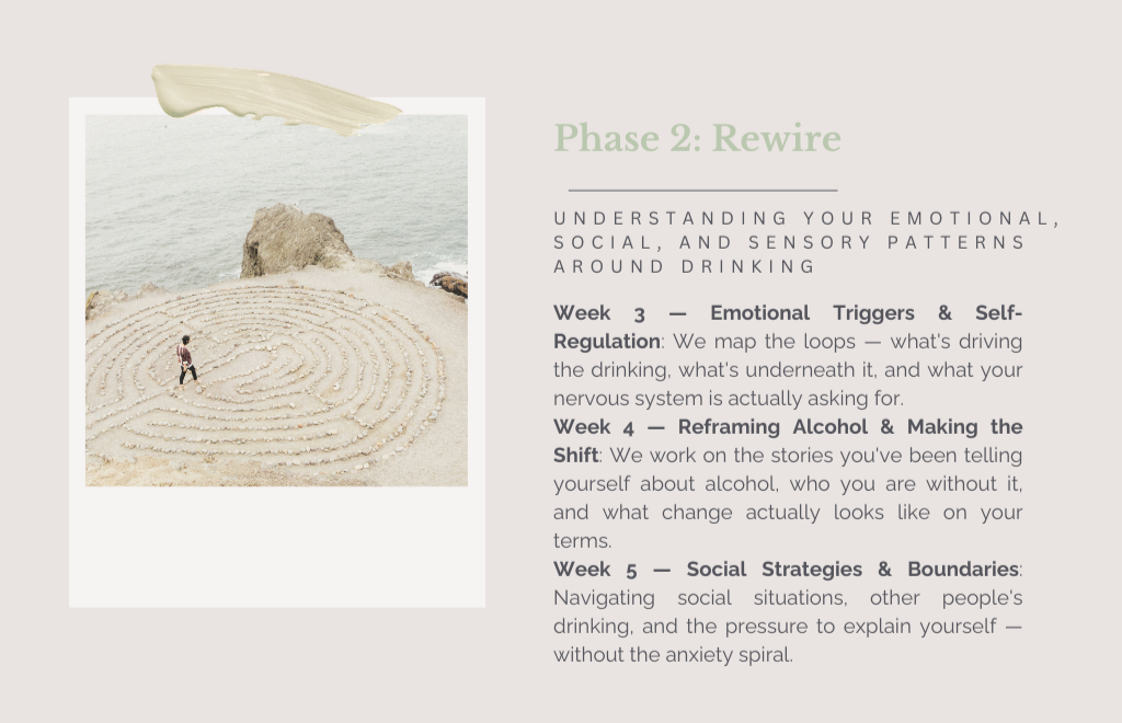 A person walking through a spiral-shaped sand maze on a beach near the ocean with rocky cliffs in the background.