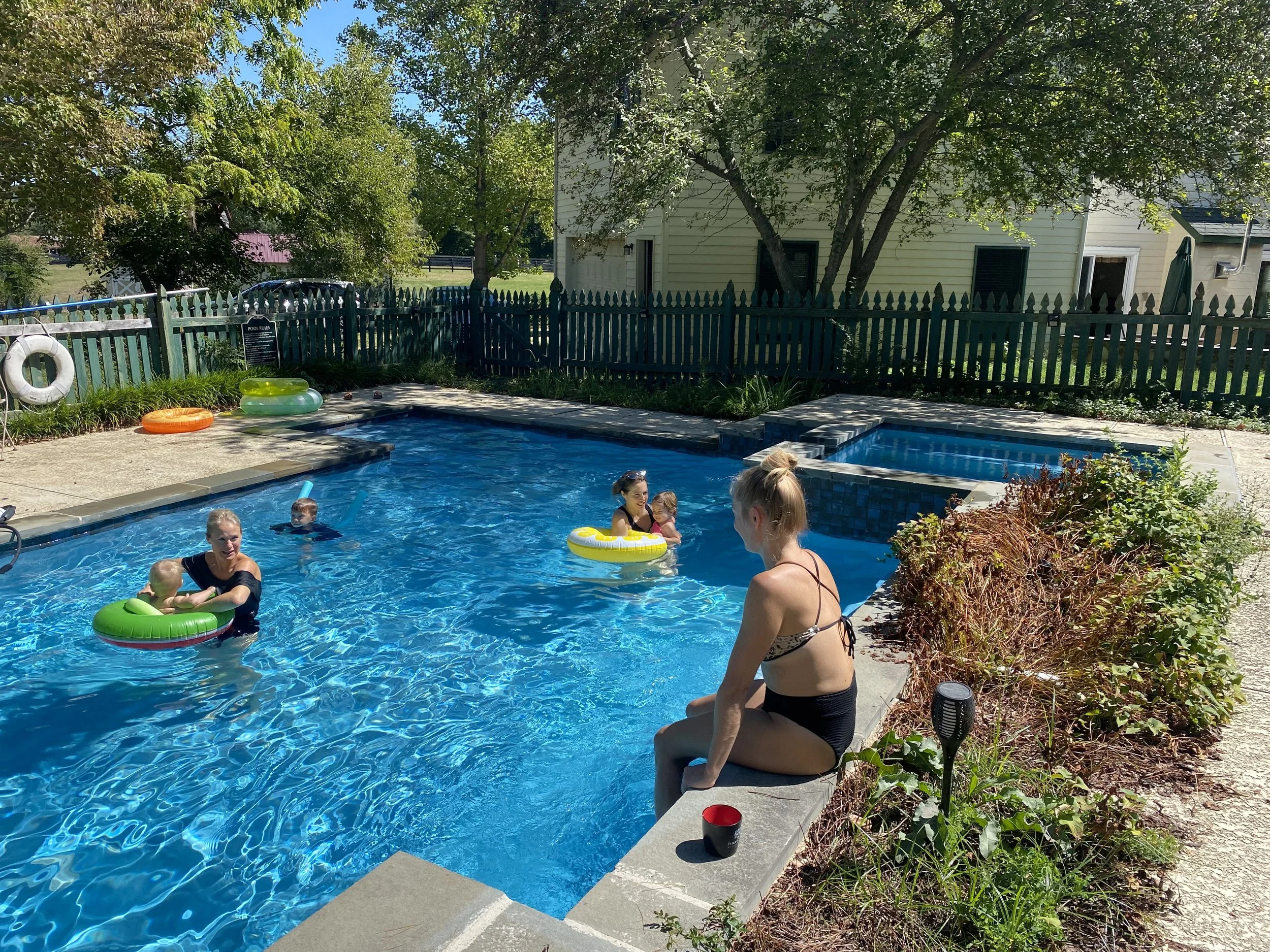 Swimmers relaxing in the seasonal saltwater pool at Barbee's X-ing, Hume VA