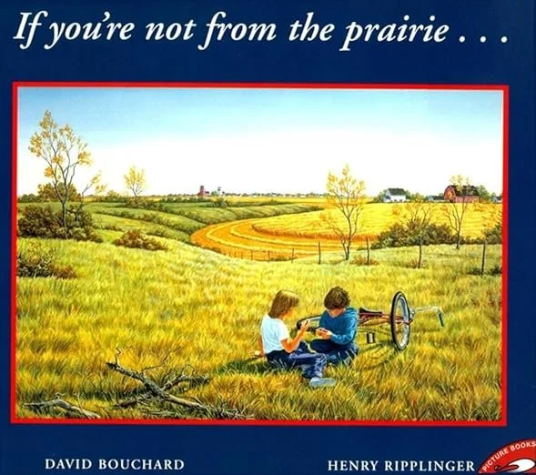 Cover of the book with a painting of a prairie and 2 children sitting by their bicycles