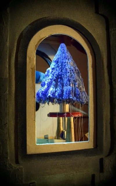 umbrella like puppet as blue shibori creature