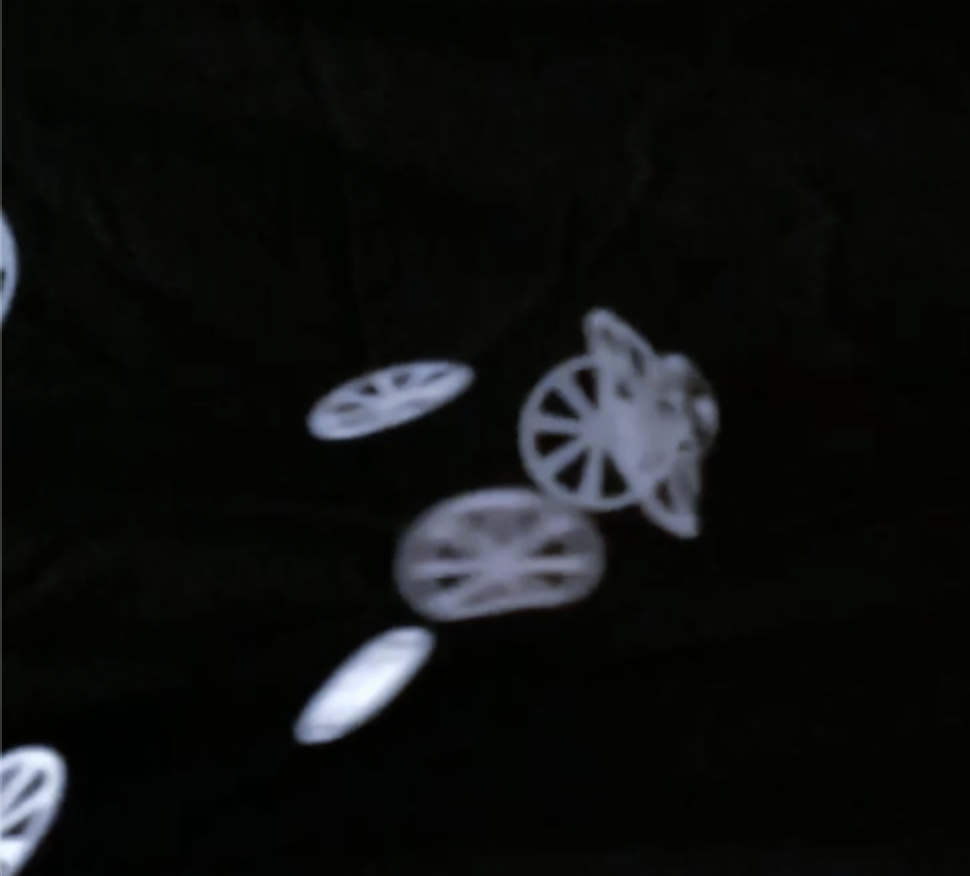 White circular shapes on a black background