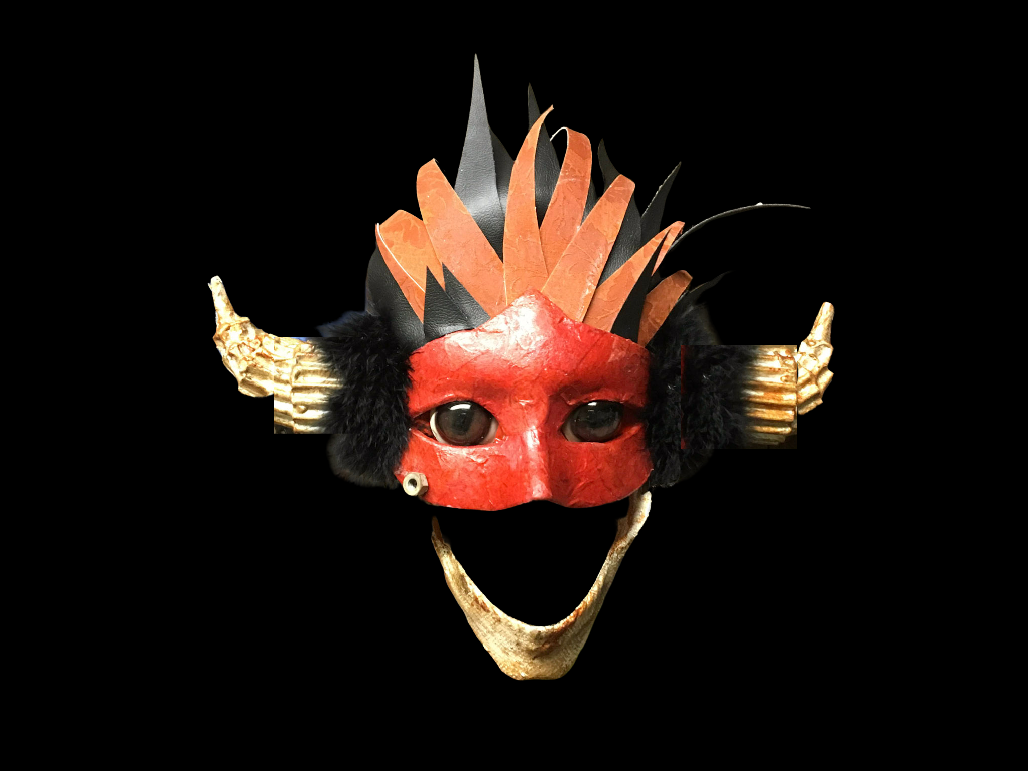 Red faced puppet with horns and big jaw