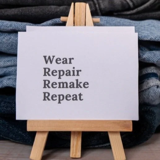 Sign says wear repair remake repeat