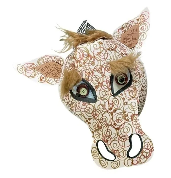 cow puppet with swirling brown colouring 