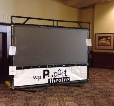 Large self standing shadow puppet screen with grey fabric and black frame