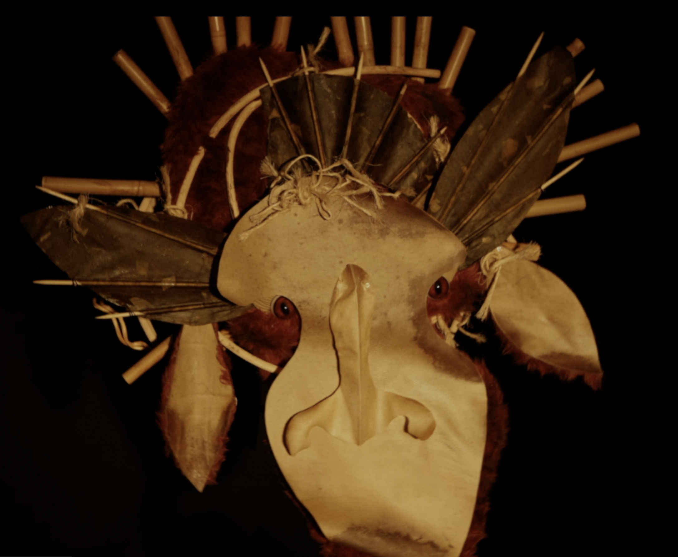 Moose like puppet with red fur and rawhide face 