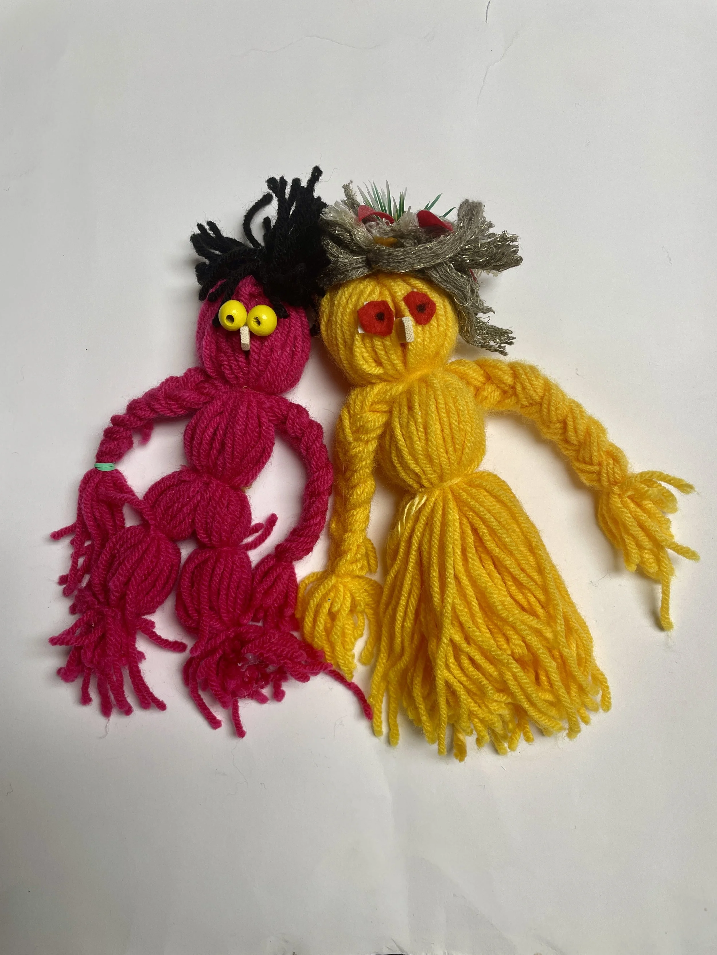 yellow and pink yarn doll puppets 