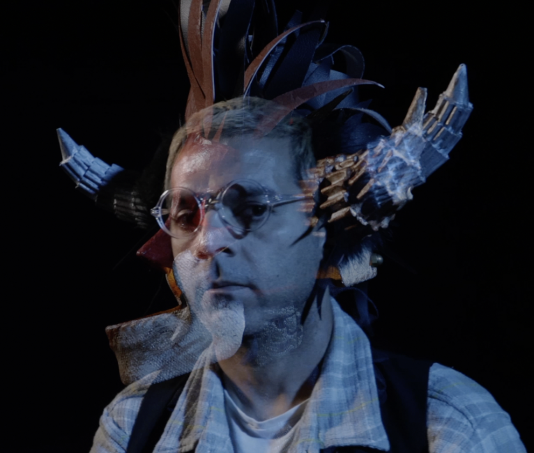 Man with glasses and theatrical horns