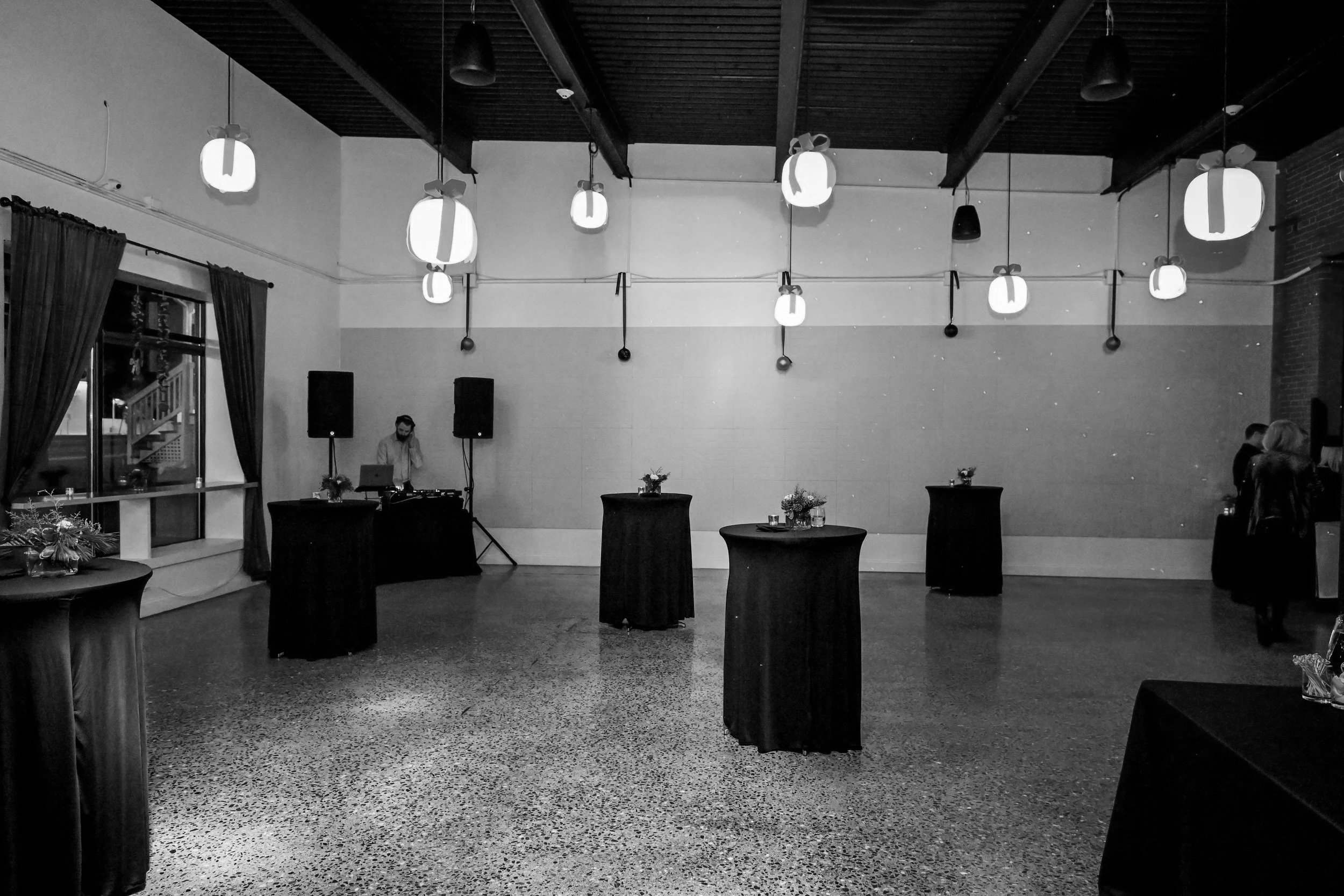Cocktail-style event setup at The 801 in Portsmouth NH with high-top tables and open floor layout