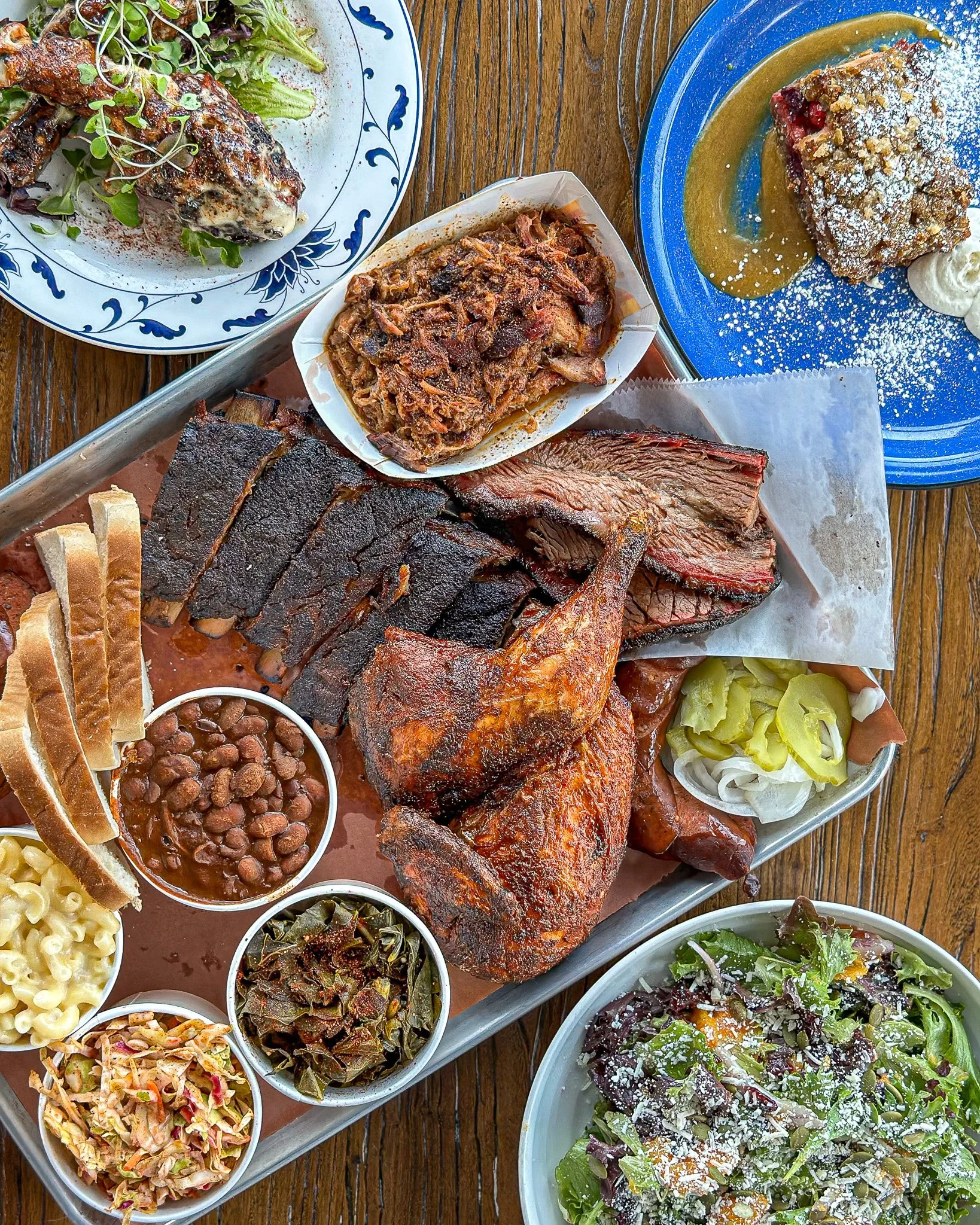 BBQ catering platter with brisket, ribs, pulled pork, smoked chicken, sides, and cornbread from Ore Nells barbecue in Kittery Maine near Portsmouth NH