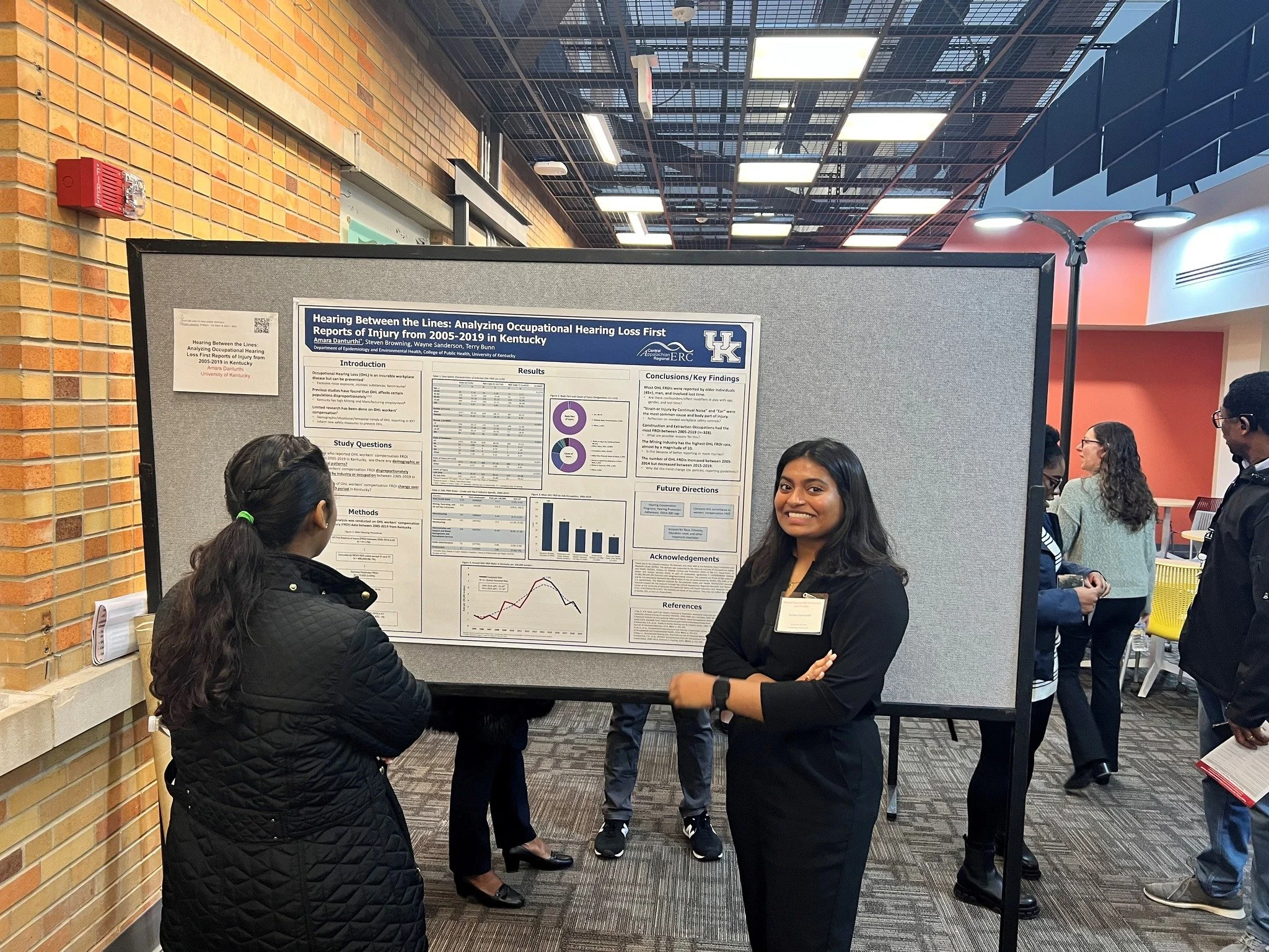 Student presenting research poster
