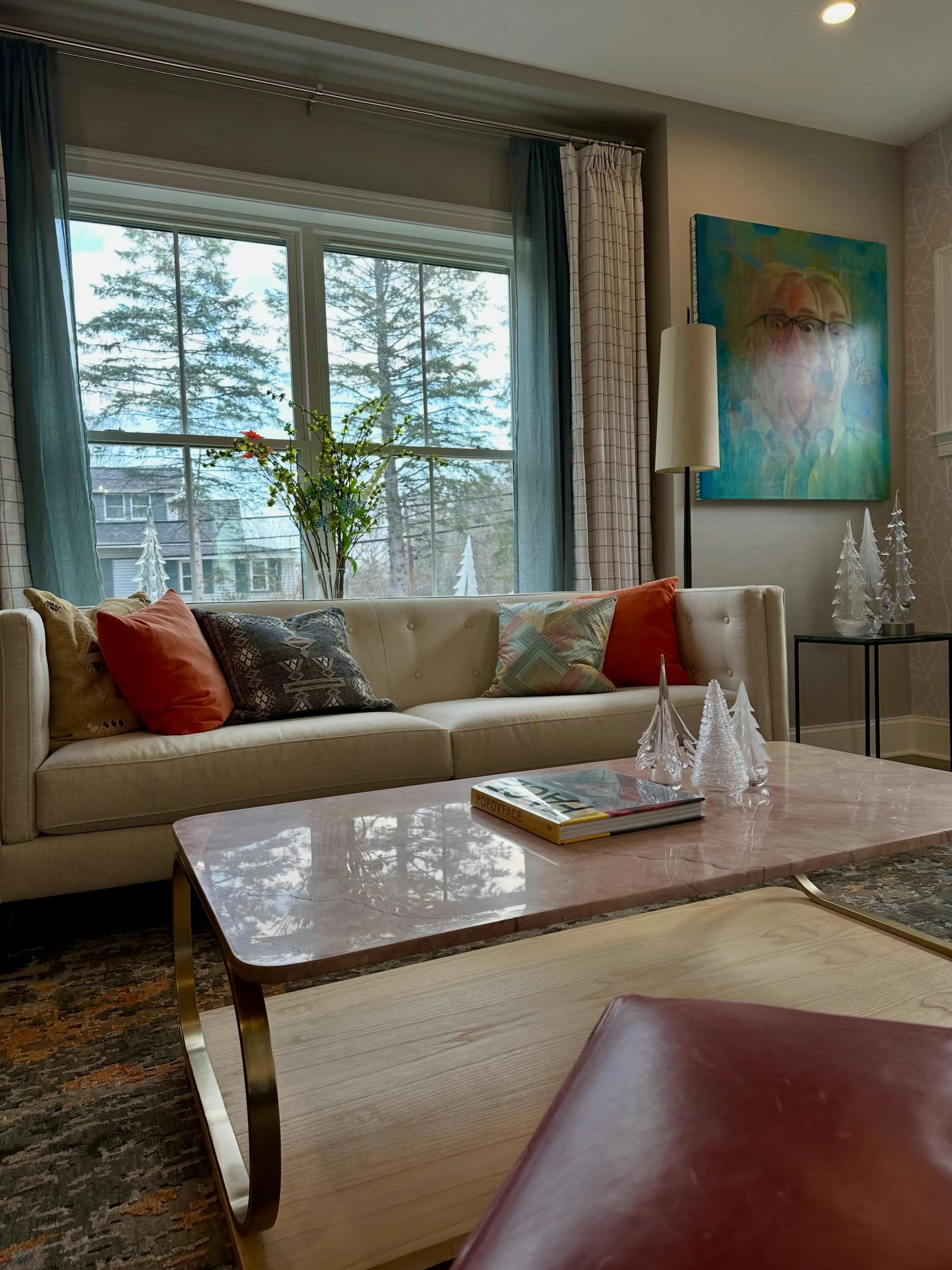 Pink coffee table, red leather, coral door and pillow, huge teal custom art. If this is wrong, I don&rsquo;t wanna be right.