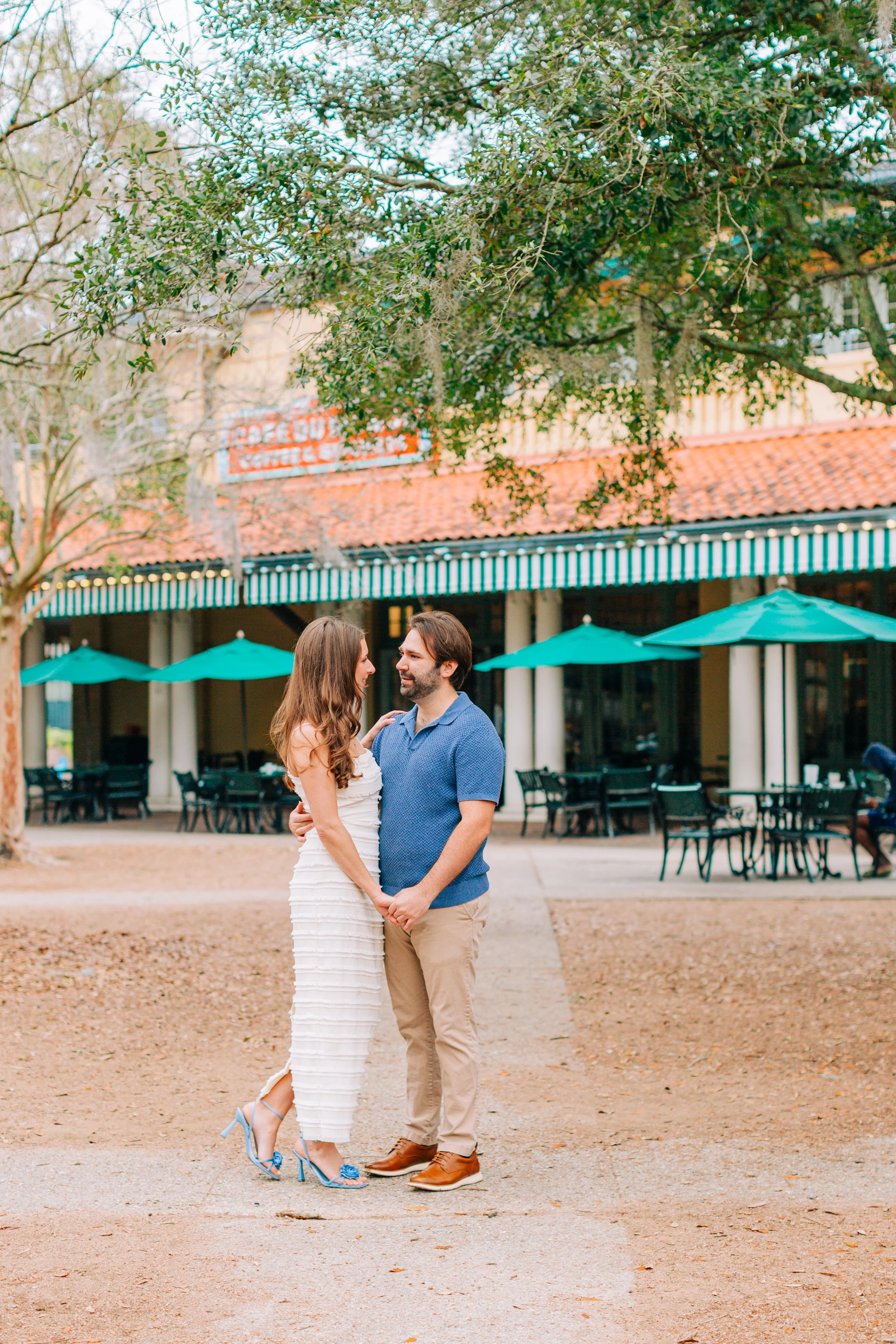 victoria and patrick’s new orleans city park engagement photos, couple dancing in city park in front of café du monde, baton rouge wedding photography, sarah shaw photography