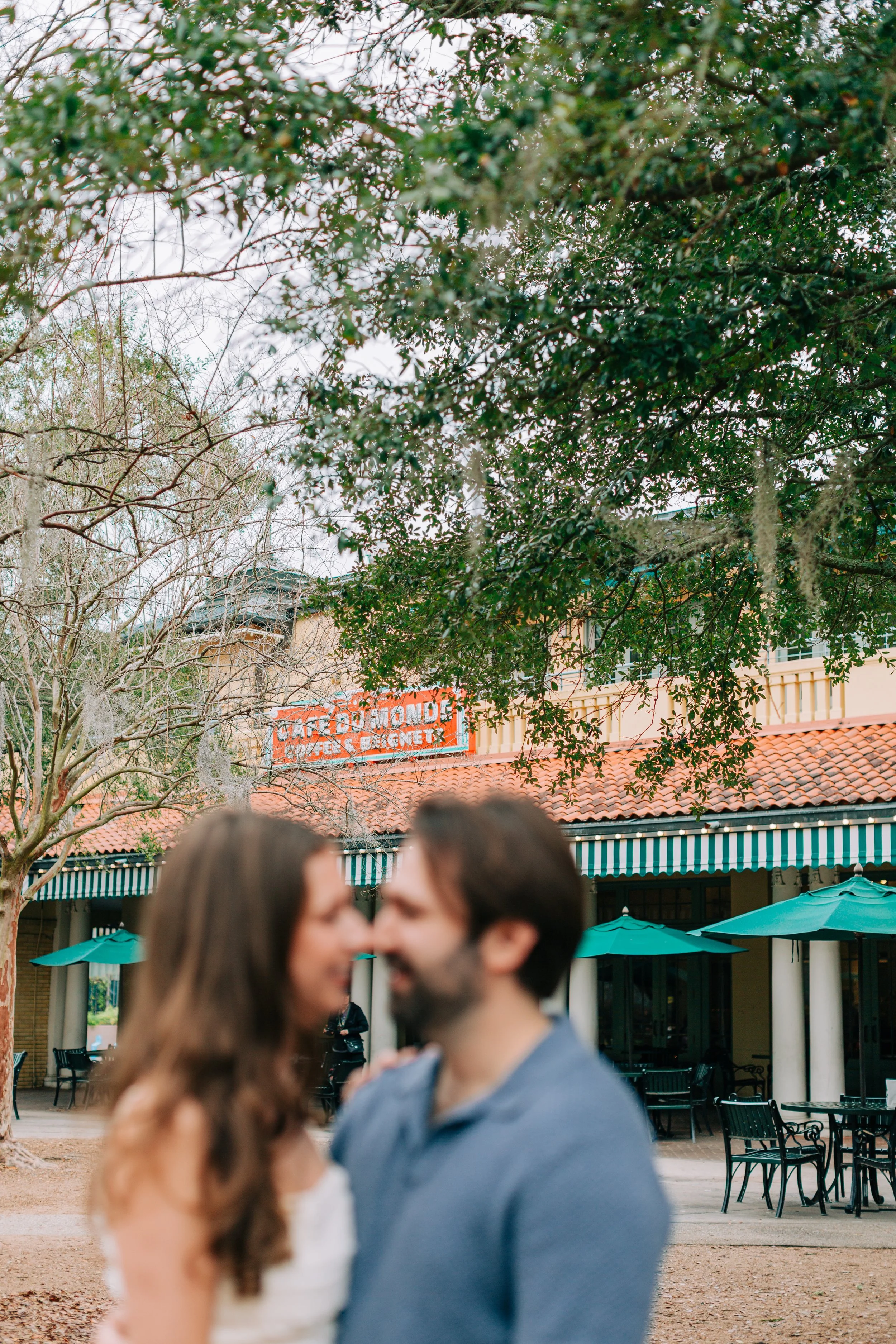 victoria and patrick’s new orleans city park engagement photos, couple dancing in city park in front of café du monde, baton rouge wedding photography, sarah shaw photography