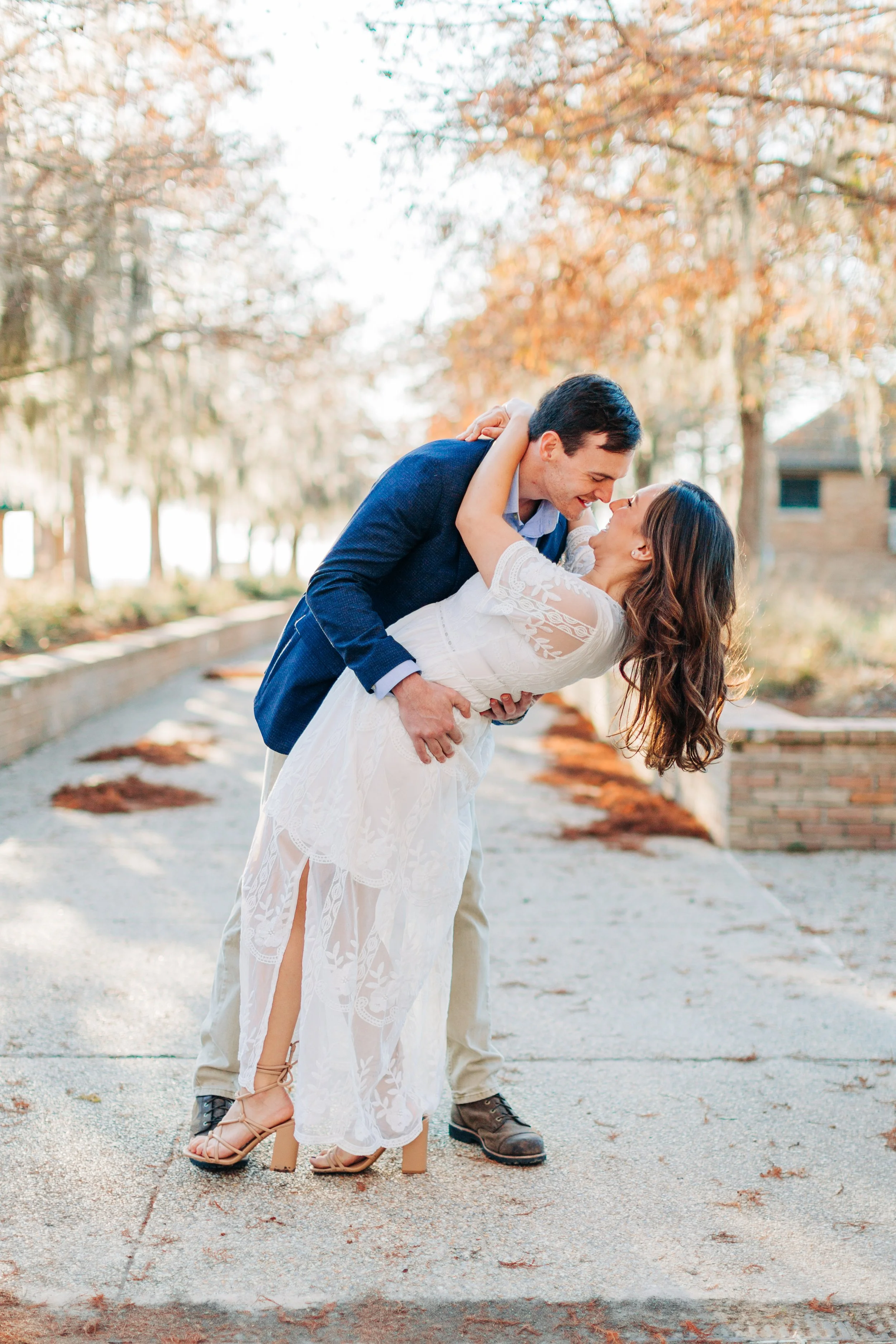 alee and ben’s sunset engagement photos at fontainebleau state park with sarah shaw photography, engagement photos on a dock by the water, new orleans engagement photography, baton rouge engagement