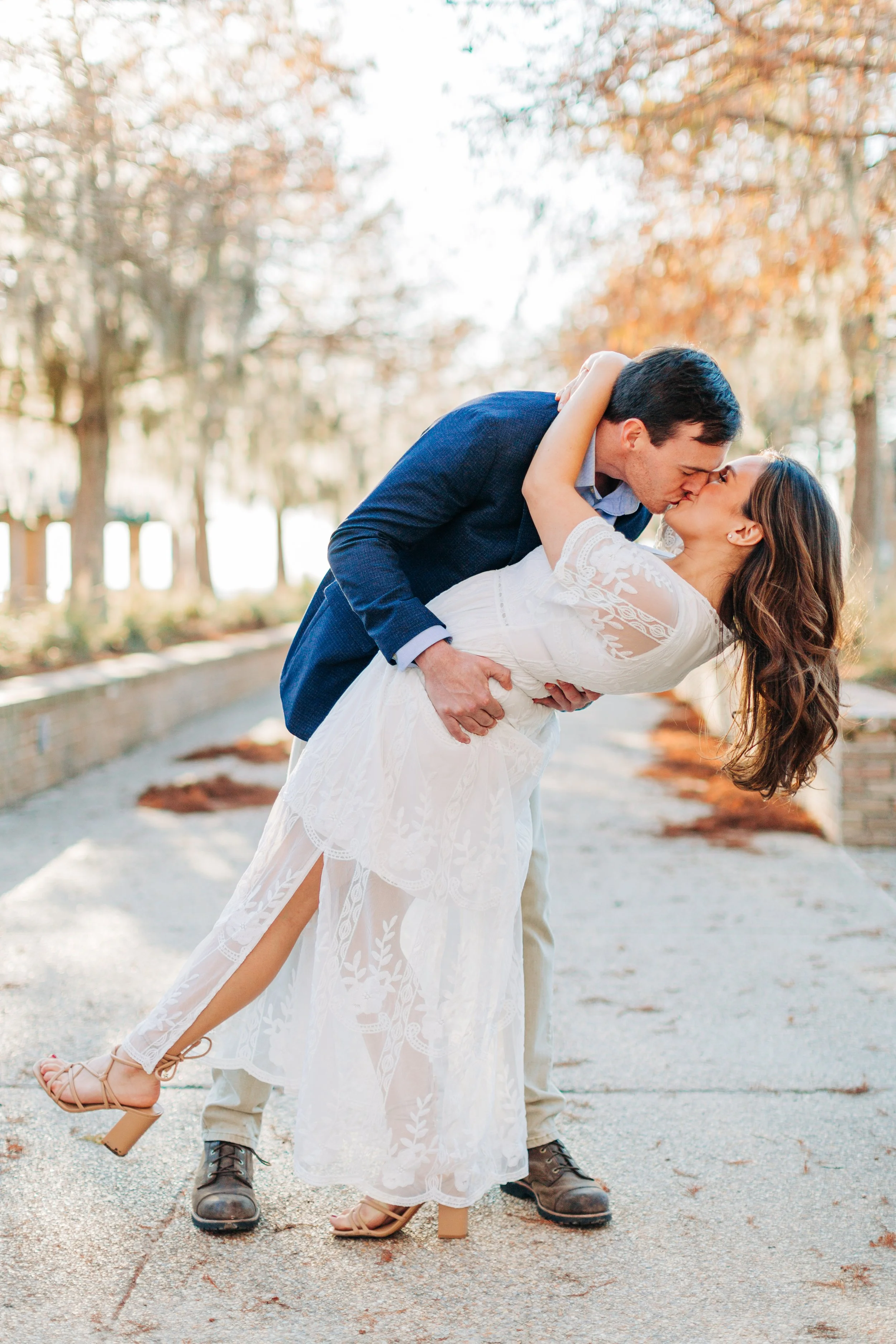 alee and ben’s sunset engagement photos at fontainebleau state park with sarah shaw photography, engagement photos on a dock by the water, new orleans engagement photography, baton rouge engagement