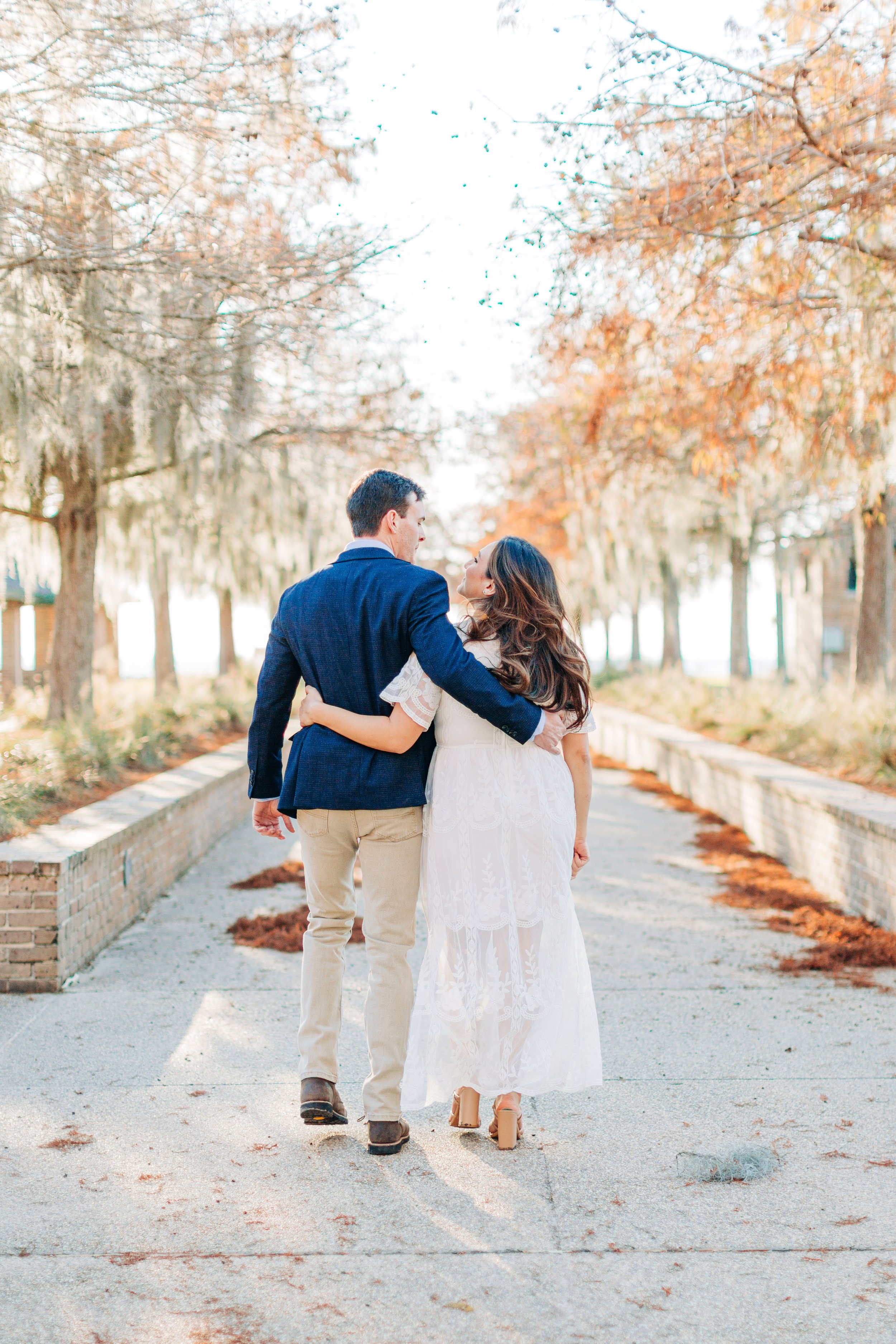 alee and ben’s sunset engagement photos at fontainebleau state park with sarah shaw photography, engagement photos on a dock by the water, new orleans engagement photography, baton rouge engagement