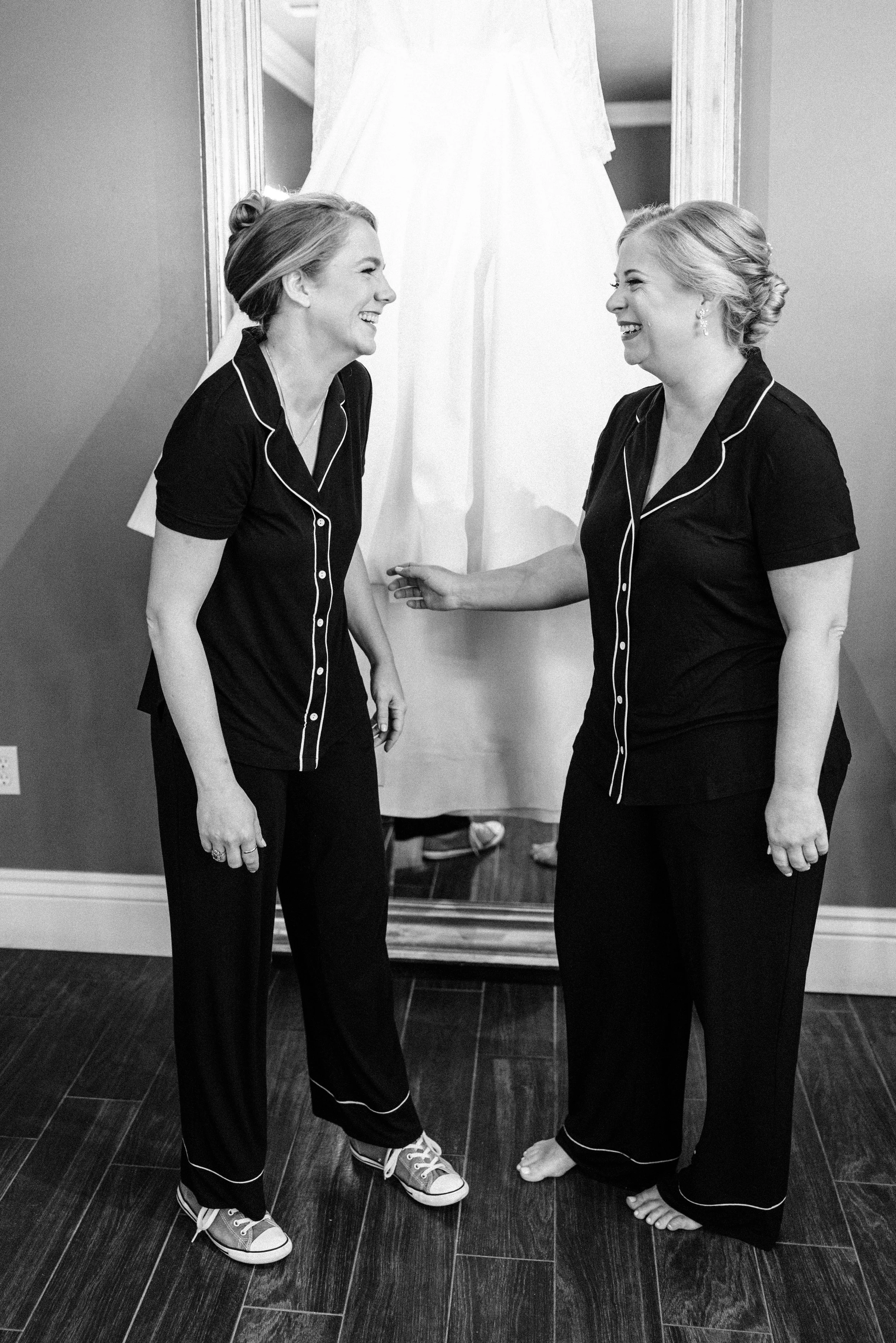 bride and maid of honor in their pajamas in the bridal suite at the neptune at houmas house baton rouge, houmas house wedding photography, sarah shaw photography