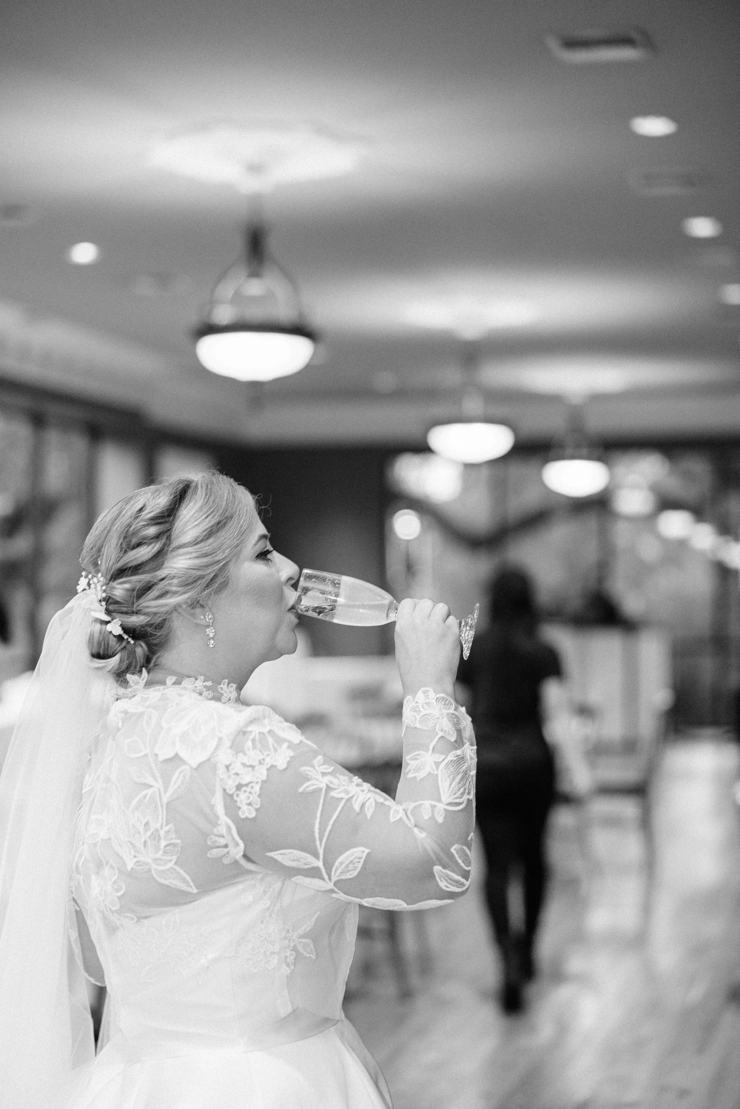 bride sips champagne at the neptune house, houmas house wedding photography, baton rouge wedding photography