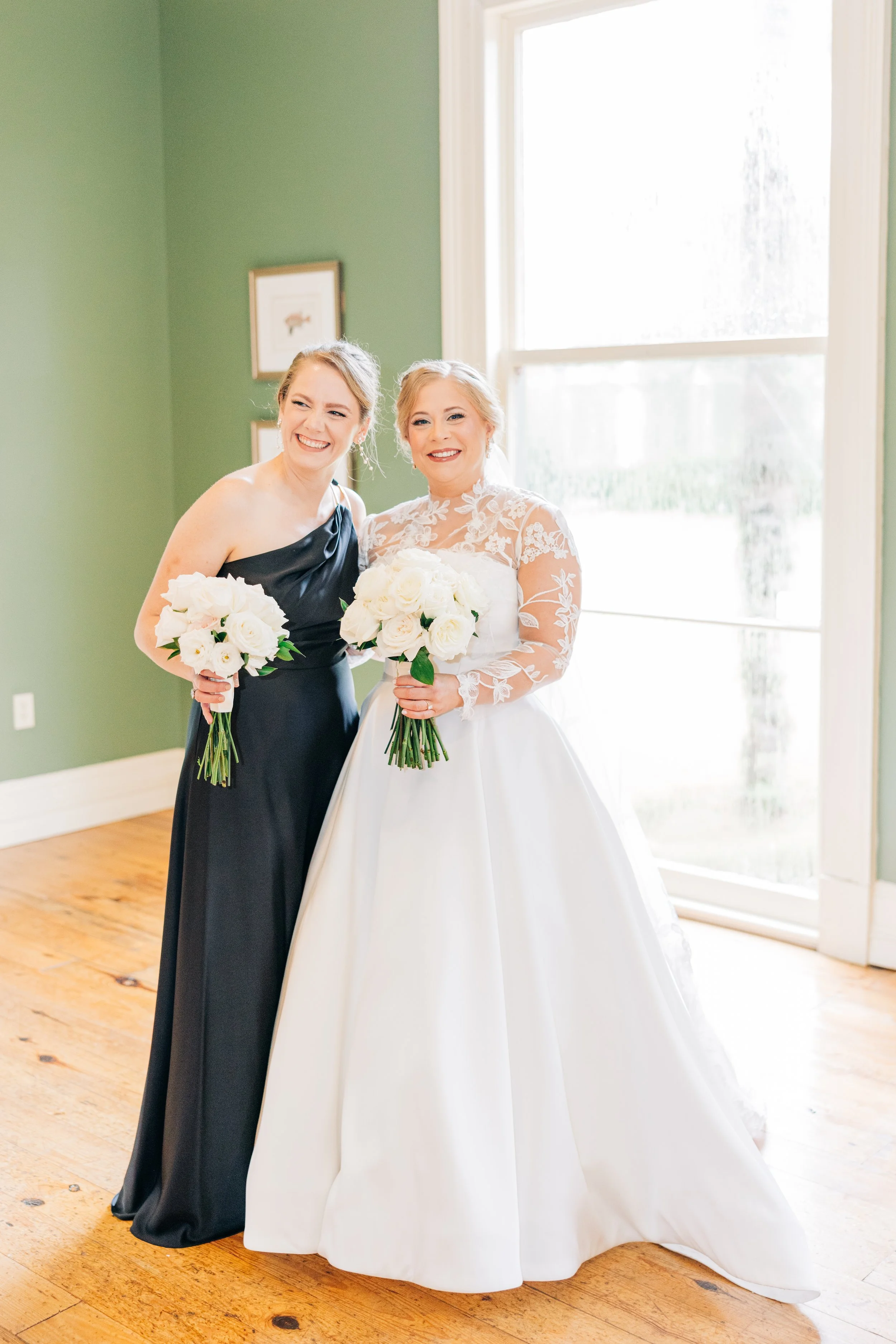 bride and maid of honor smiling in the neptune at houmas house, bridal portraits at houmas house baton rouge, baton rouge wedding photography, sarah shaw photography