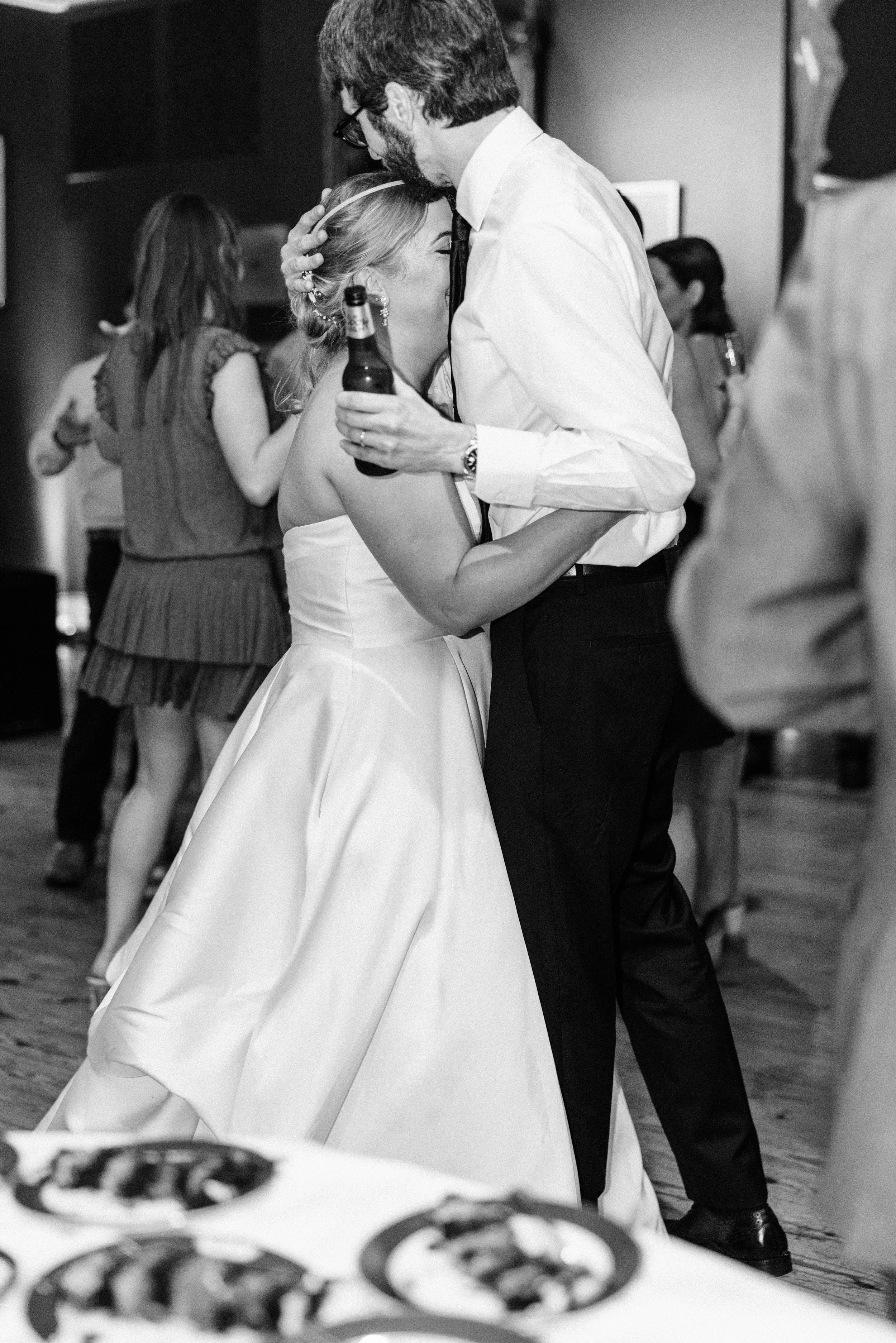bride and groom hugging at their wedding reception in the neptune at houmas house in baton rouge, baton rouge wedding photography