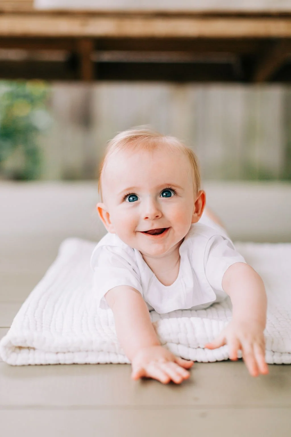 6 month baby boy smiling during milestone session in Baton Rouge
