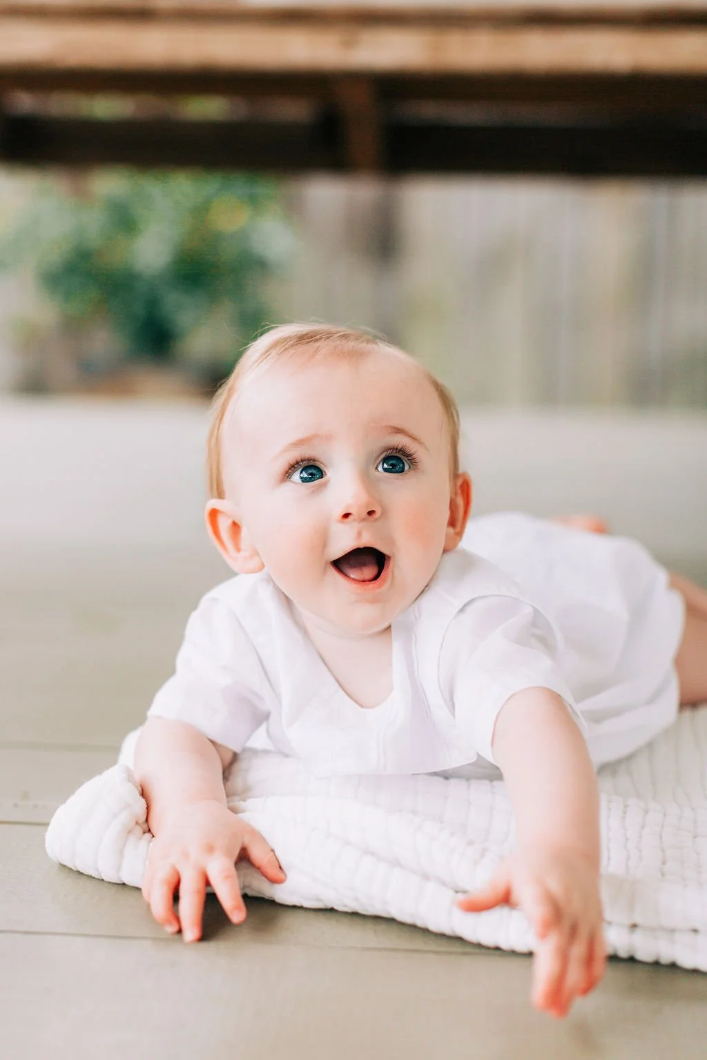 6 month baby boy smiling during milestone session in Baton Rouge