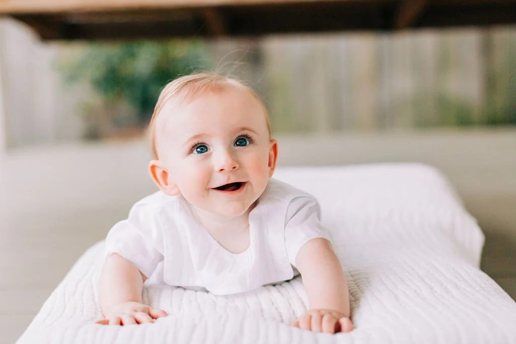 6 month baby boy smiling during milestone session in Baton Rouge