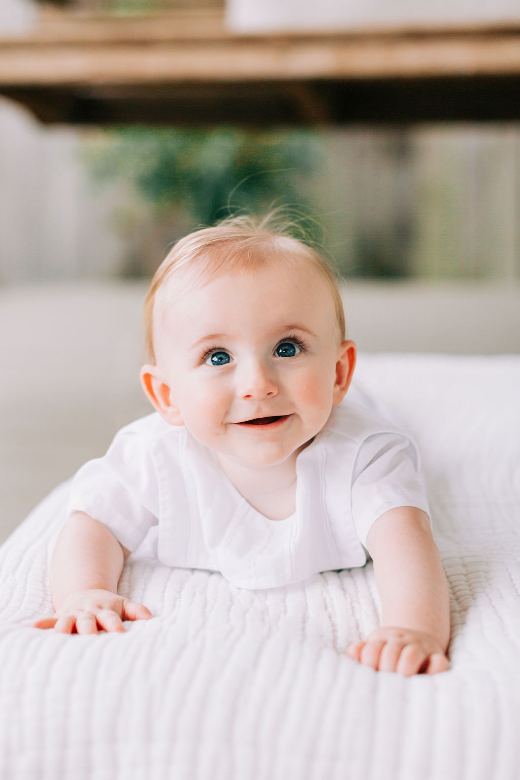 6 month baby boy smiling during milestone session in Baton Rouge