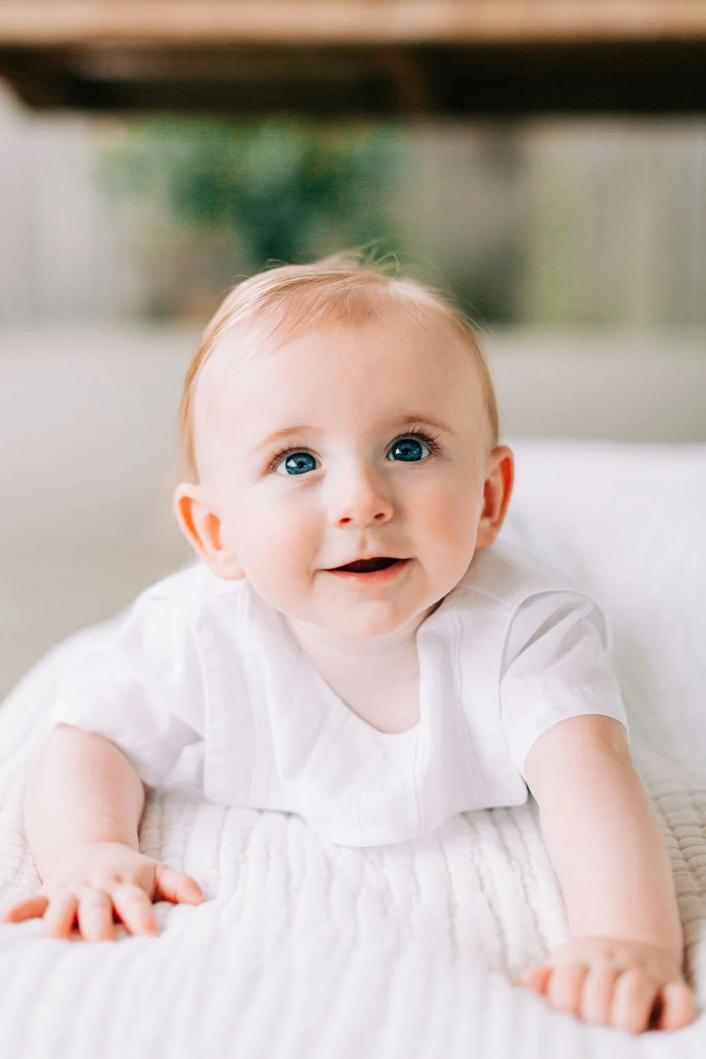 6 month baby boy smiling during milestone session in Baton Rouge