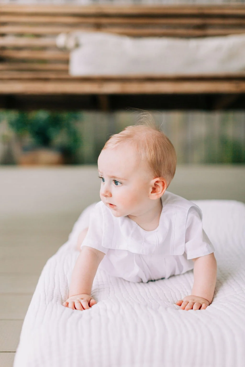 6 month baby boy side portrait during milestone session in Baton Rouge