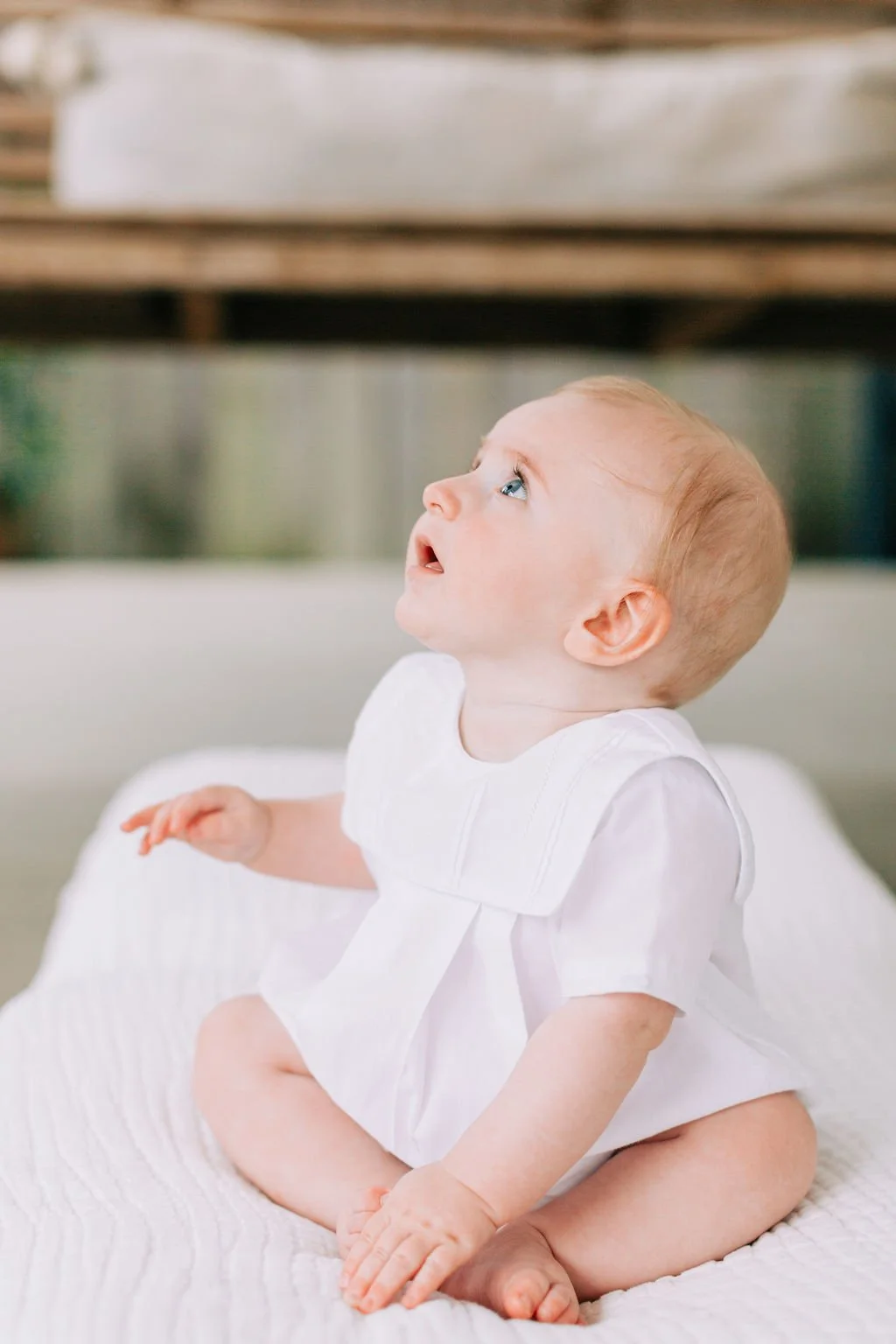 6 month baby boy side portrait during milestone session in Baton Rouge