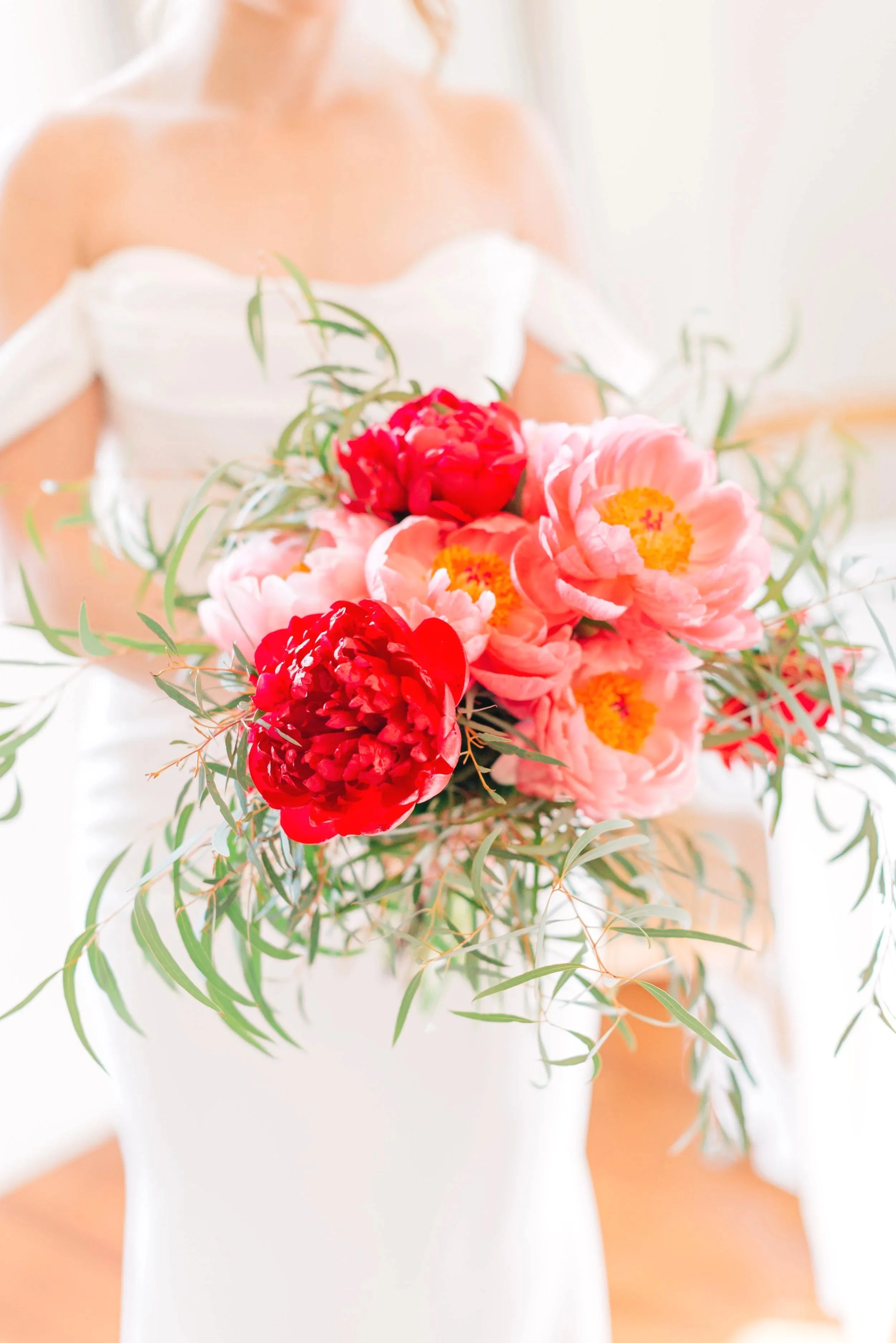 baton rouge bridal portraits, close up of bridal bouquet of red and pink peonies