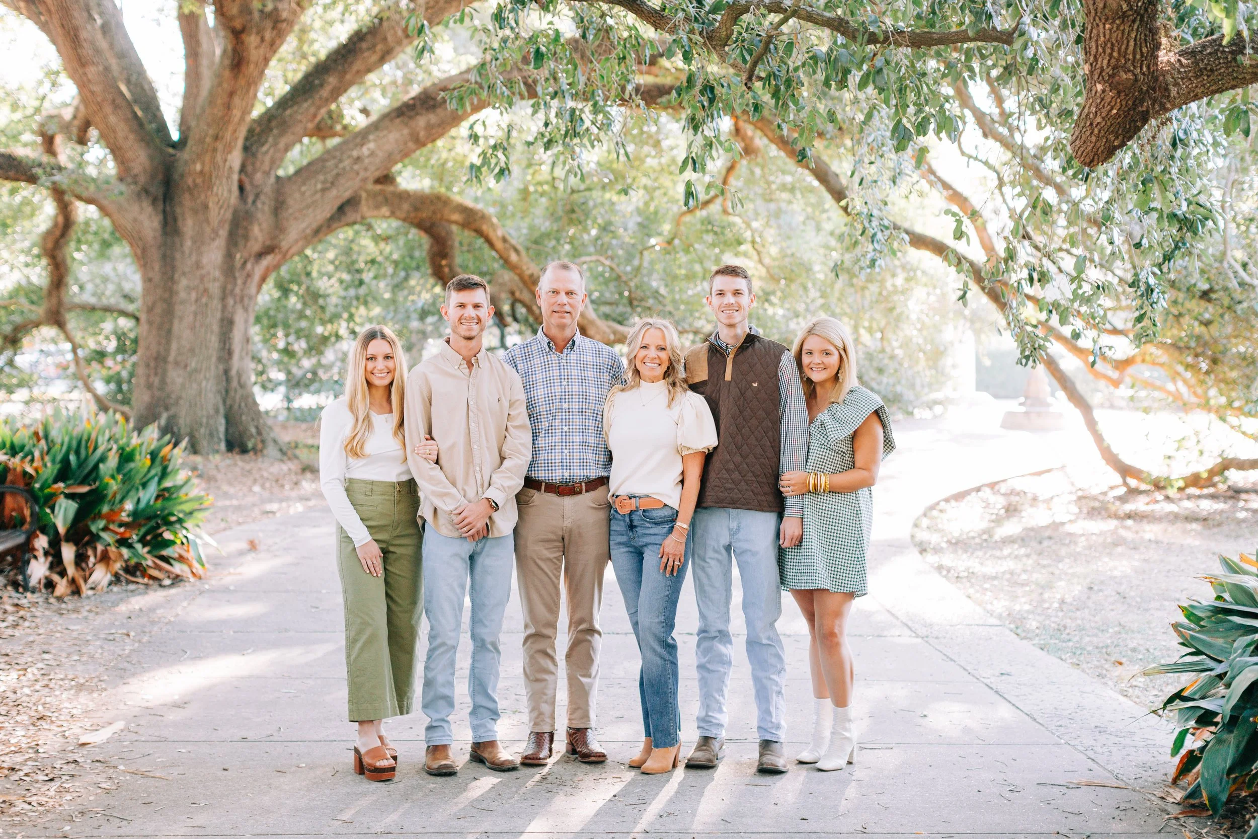 Extended family posing together under oak trees during Baton Rouge family photography session