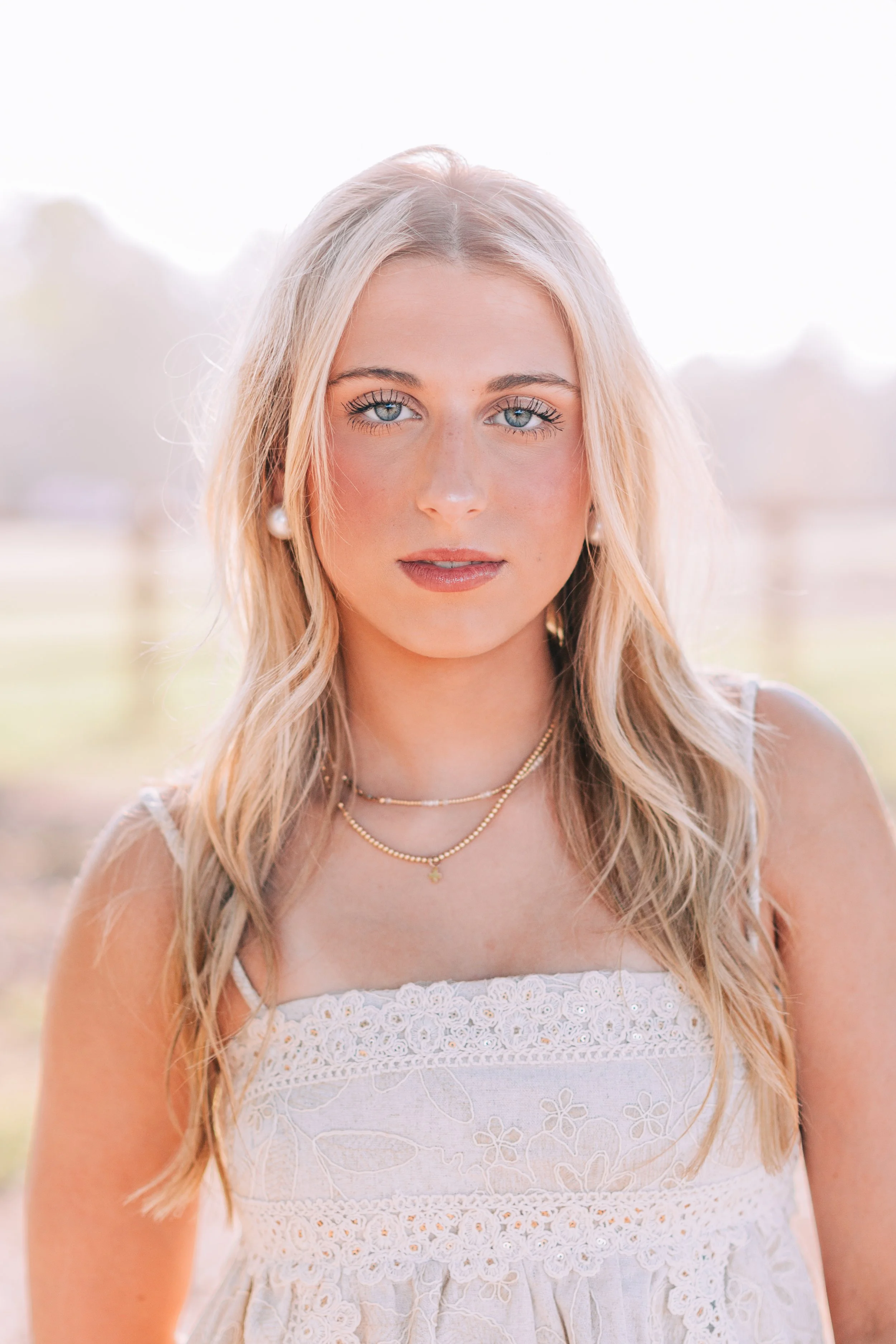 baton rouge senior portraits at burden gardens, blond haired girl close-up with serious expression