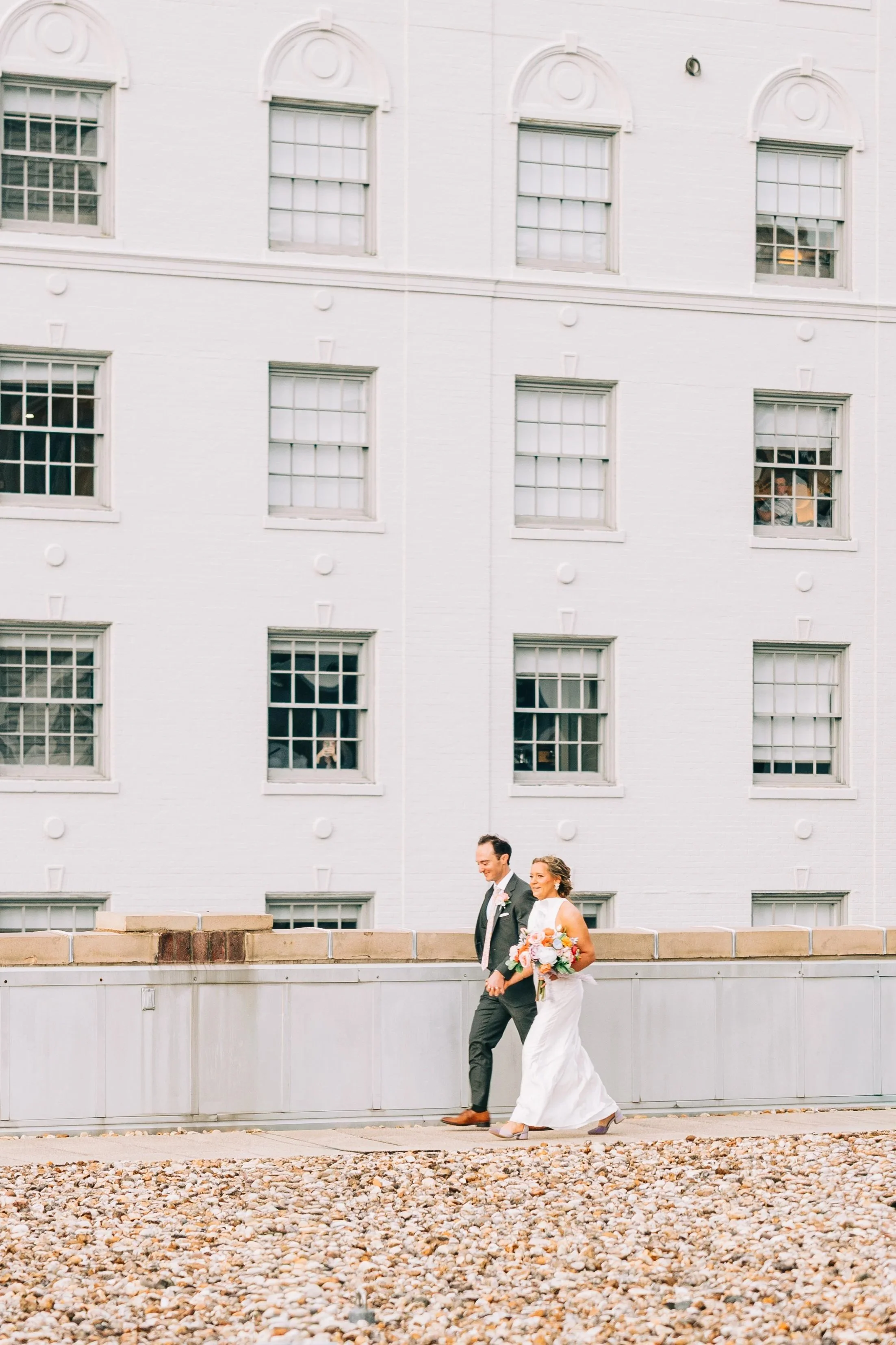 bride and groom approaching ceremony at river terrace in baton rouge