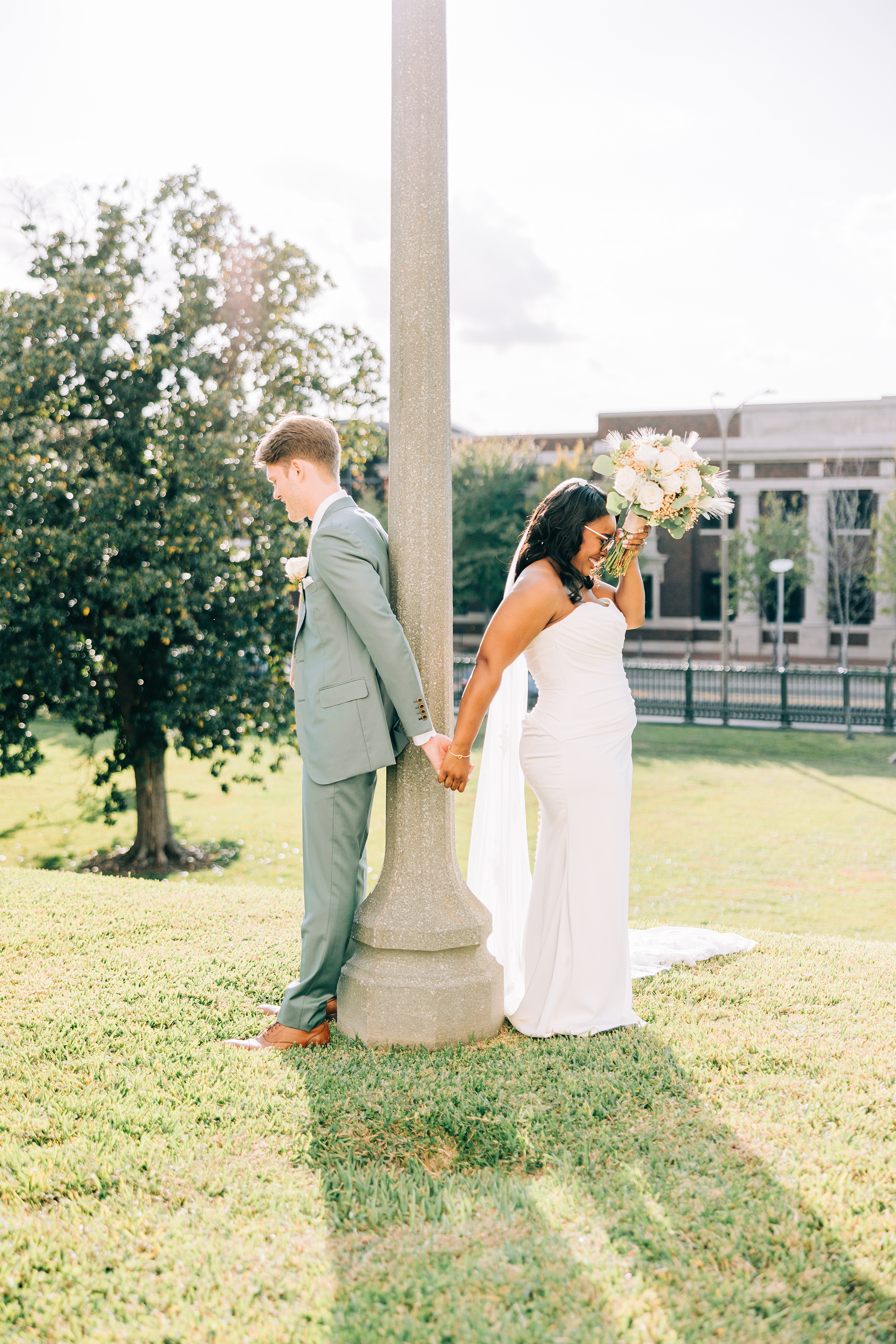 bride and groom during first touch at baton rouge wedding