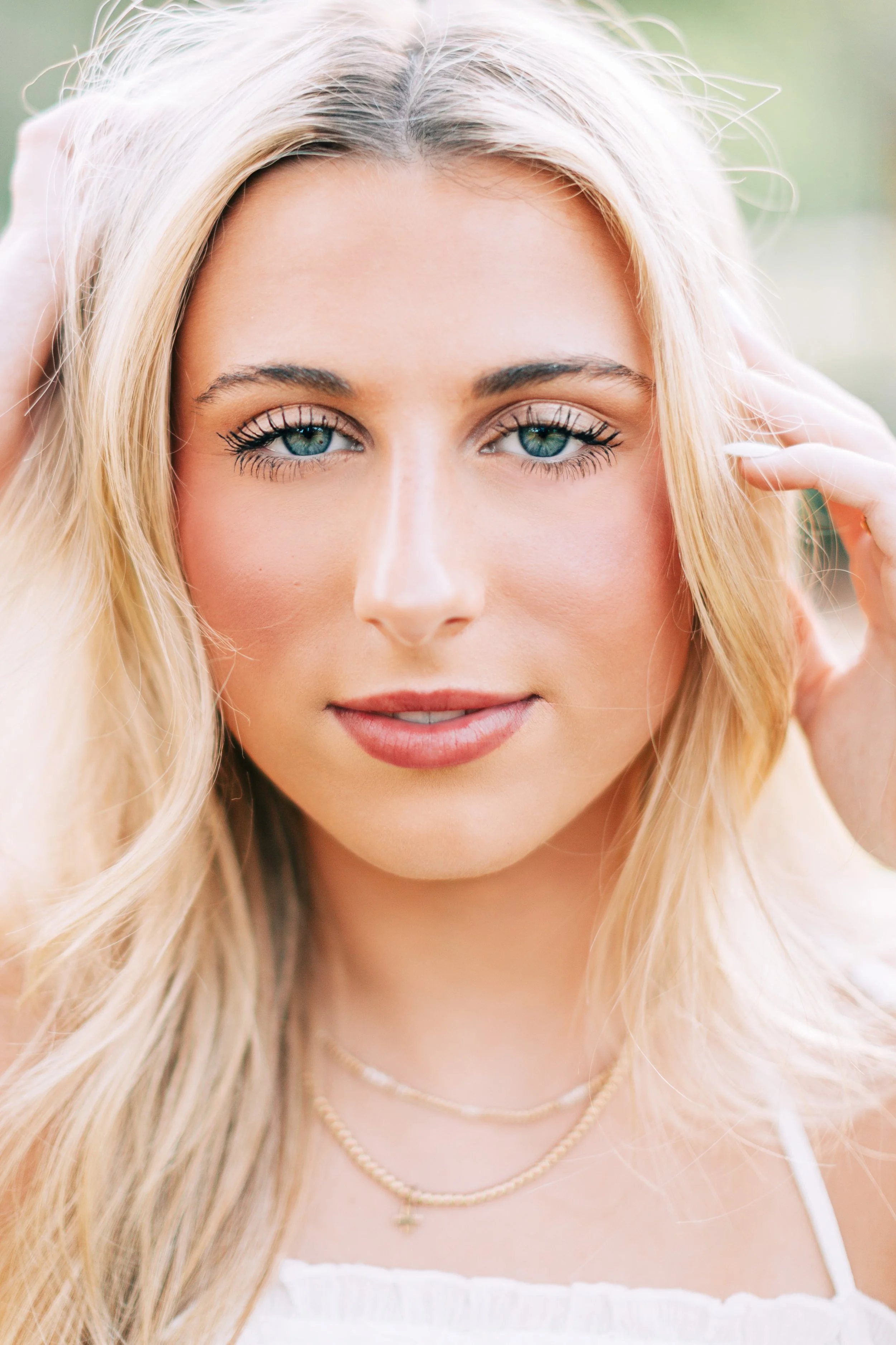 baton rouge senior portraits at burden gardens, blond haired girl close-up with serious expression