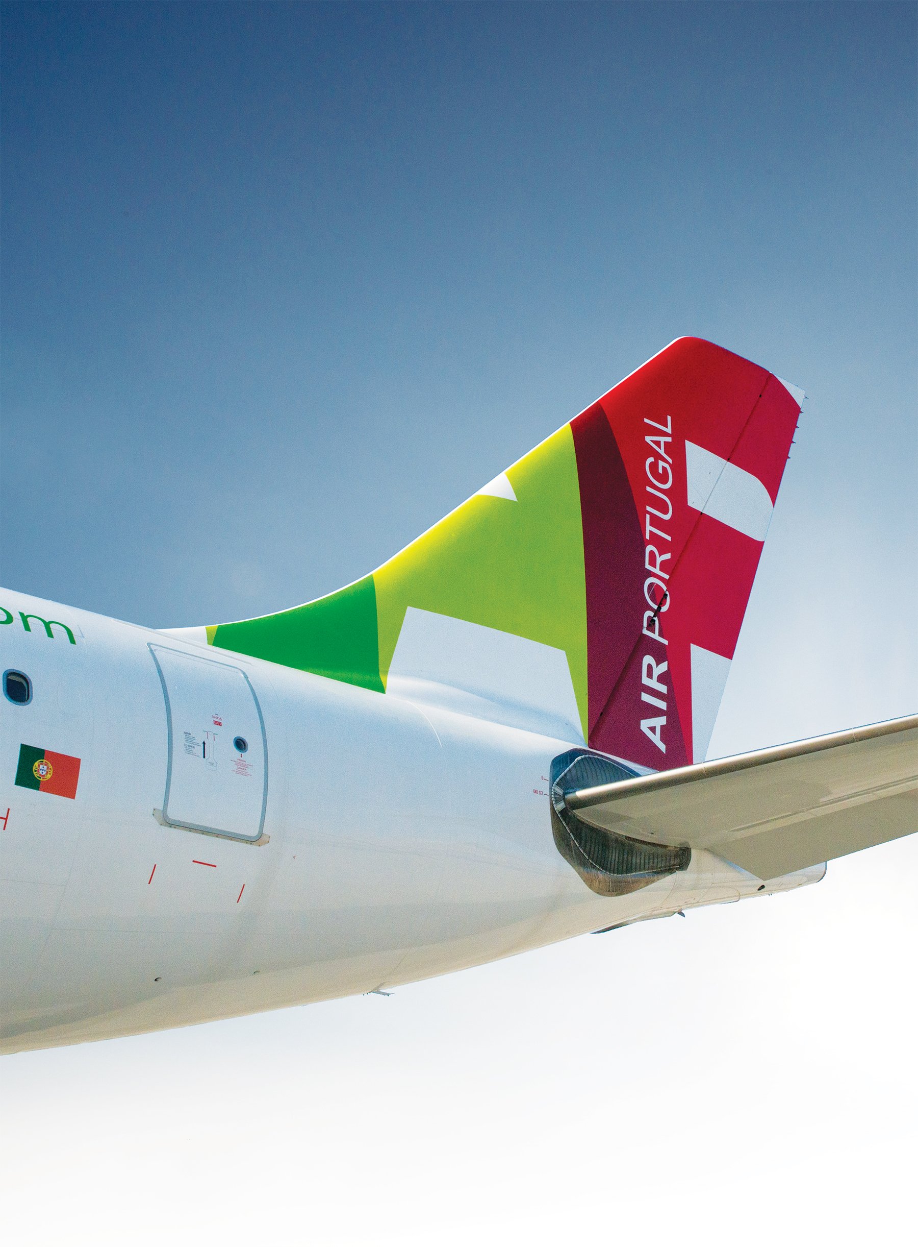 Detail photograph of the tail of a TAP Air Portugal plane.