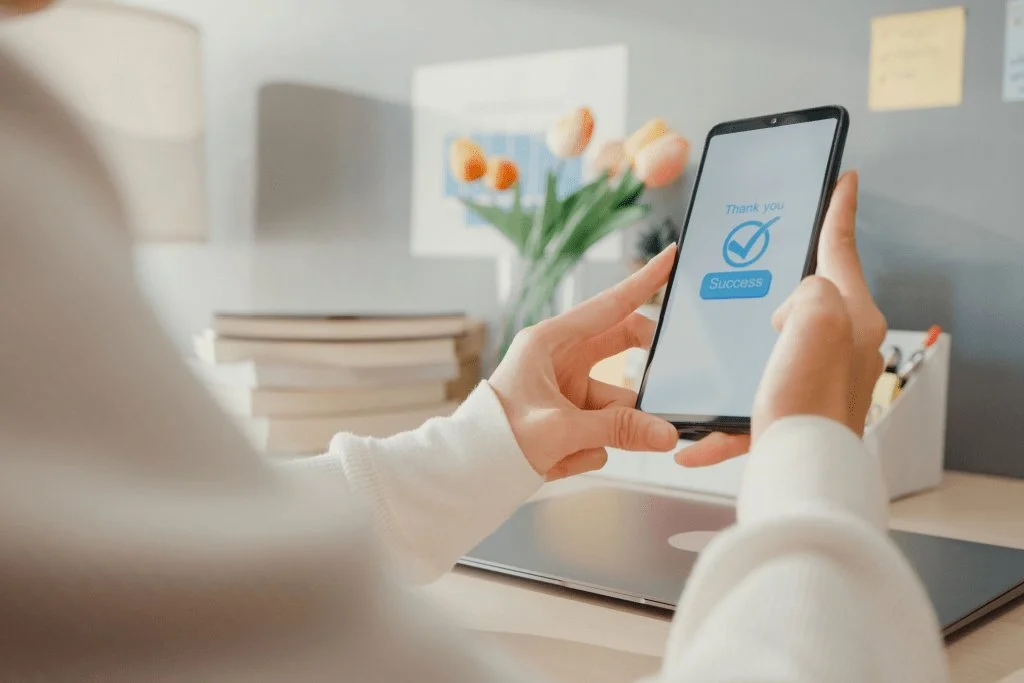 Person renting a storage unit online on a smartphone