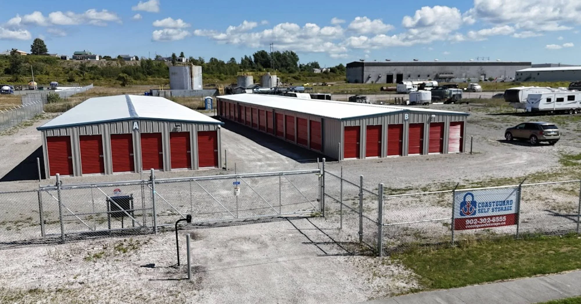 Insulated drive-up storage units with red doors at CoastGuard Self Storage