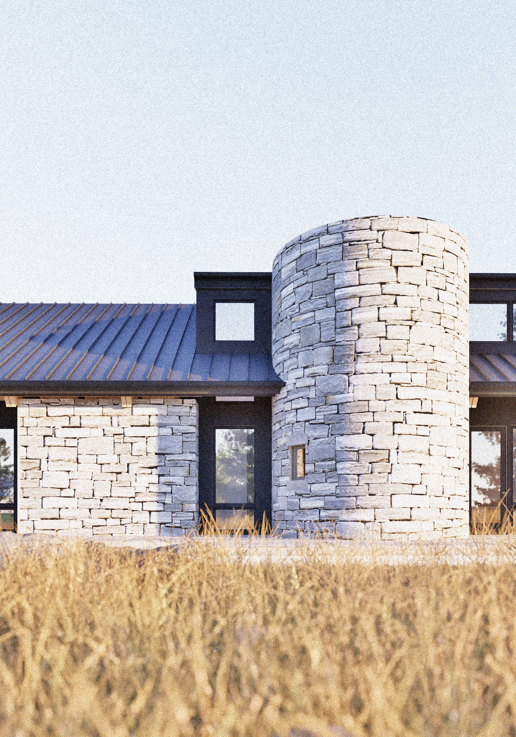 Composed of long stone slabs and dark glass walls, the Flying V Ranch House balances mass and transparency beneath two continuous gable roofs. Dormered spaces are tucked discreetly within the roofline, maintaining the calm, single-story profile from
